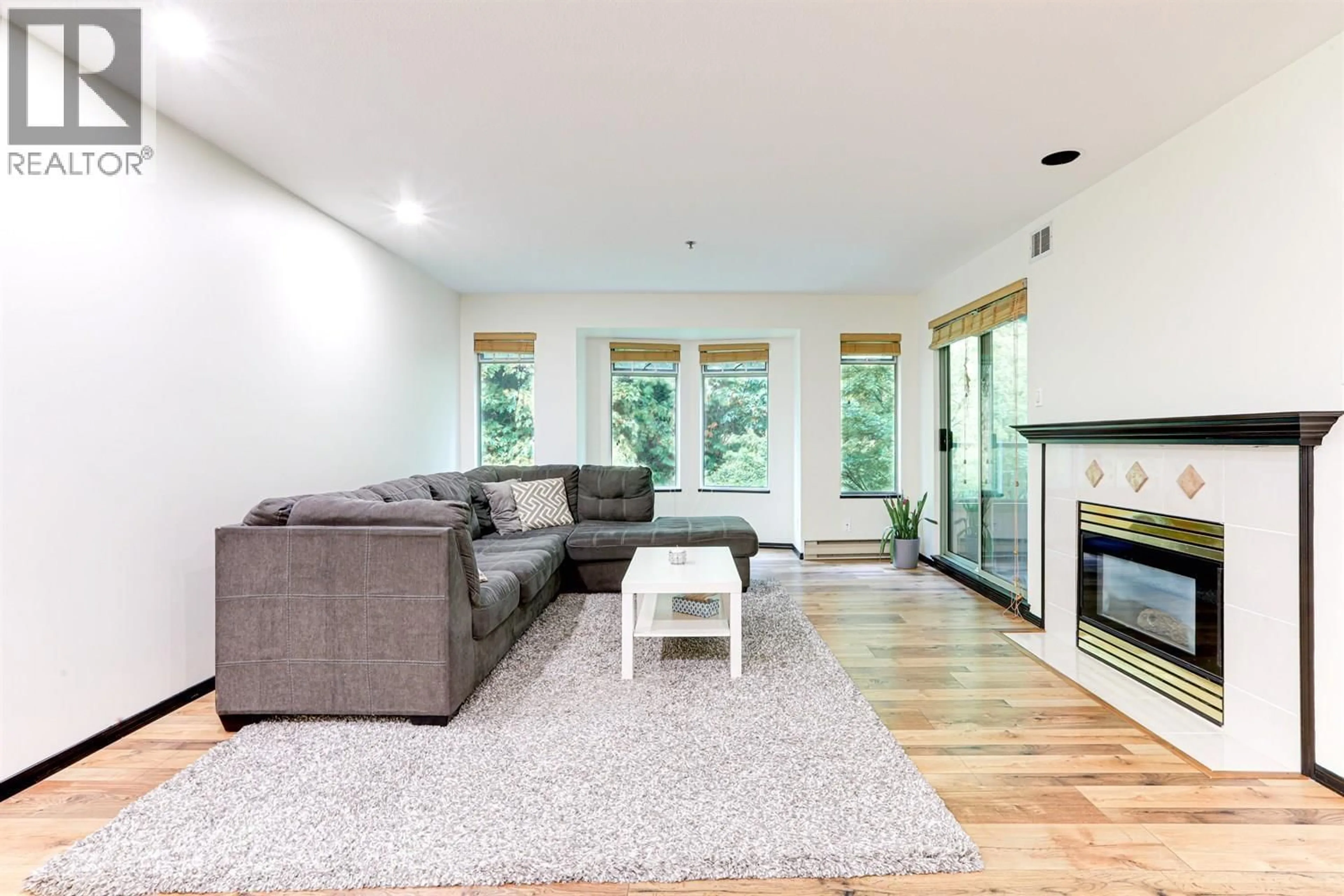 Living room with furniture, wood/laminate floor for 505 - 6737 STATION HILL COURT, Burnaby British Columbia V3N4V2
