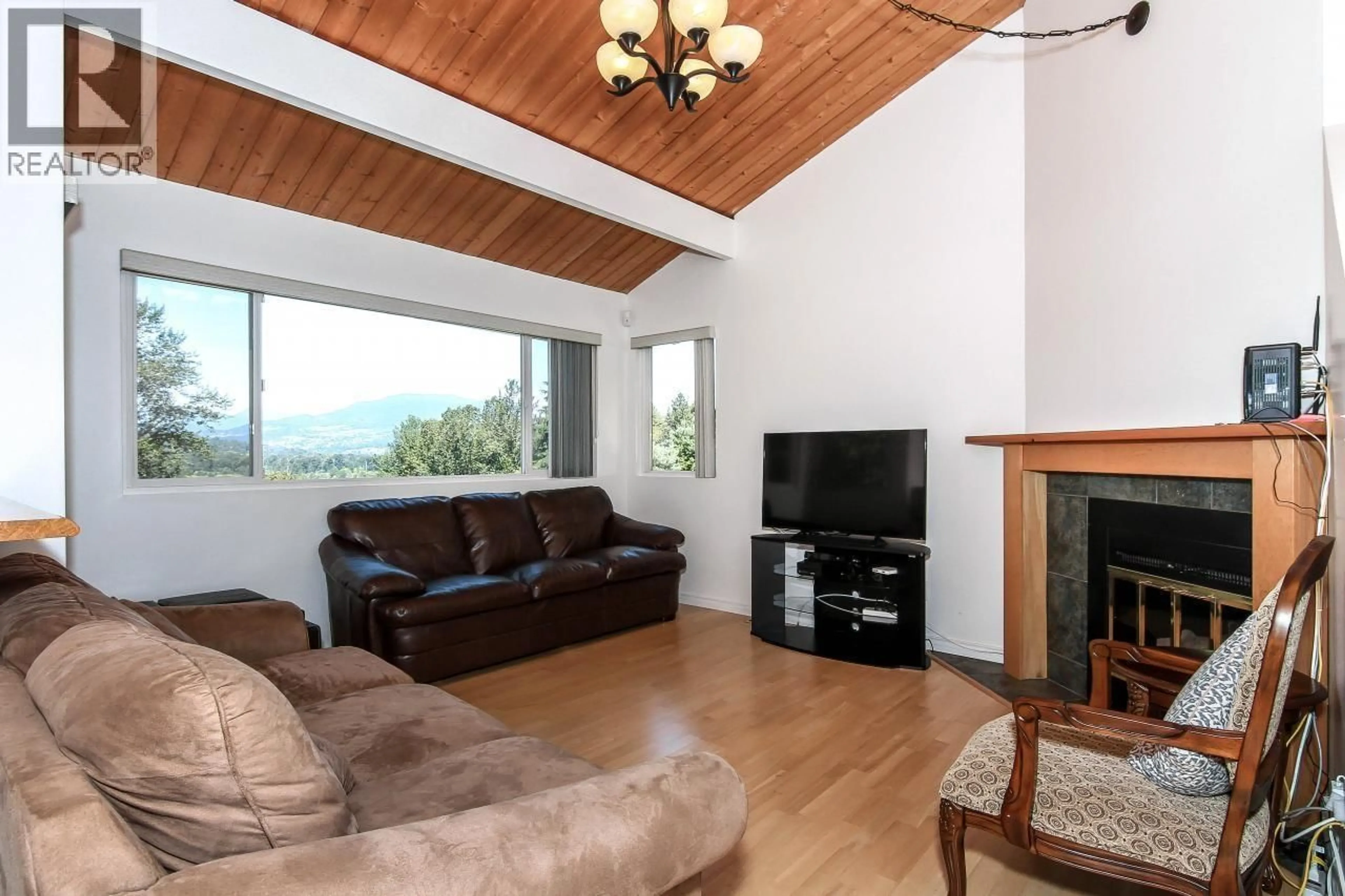 Living room with furniture, wood/laminate floor for 1525 ELINOR CRESCENT, Port Coquitlam British Columbia V3C2Y3