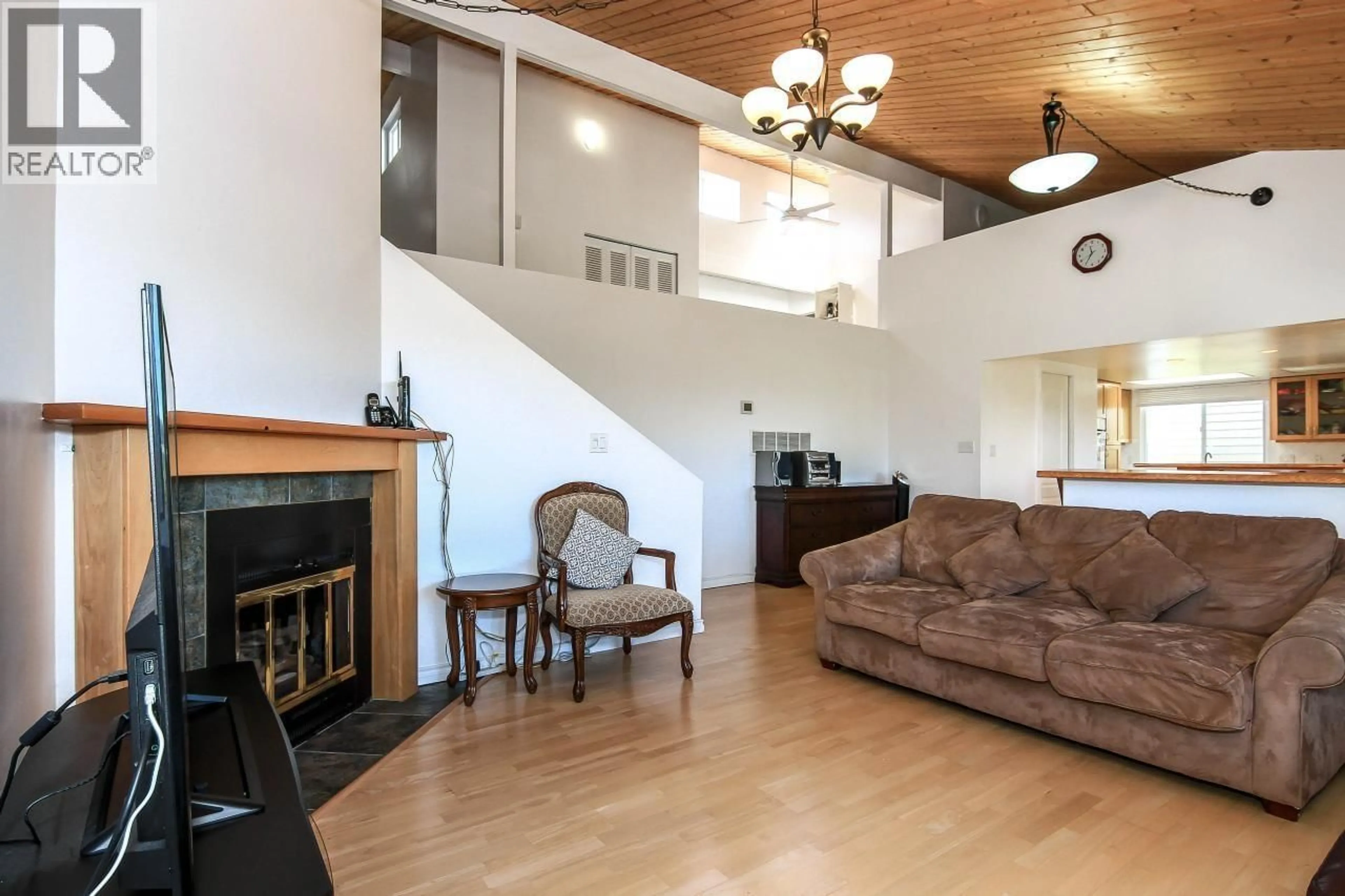 Living room with furniture, wood/laminate floor for 1525 ELINOR CRESCENT, Port Coquitlam British Columbia V3C2Y3