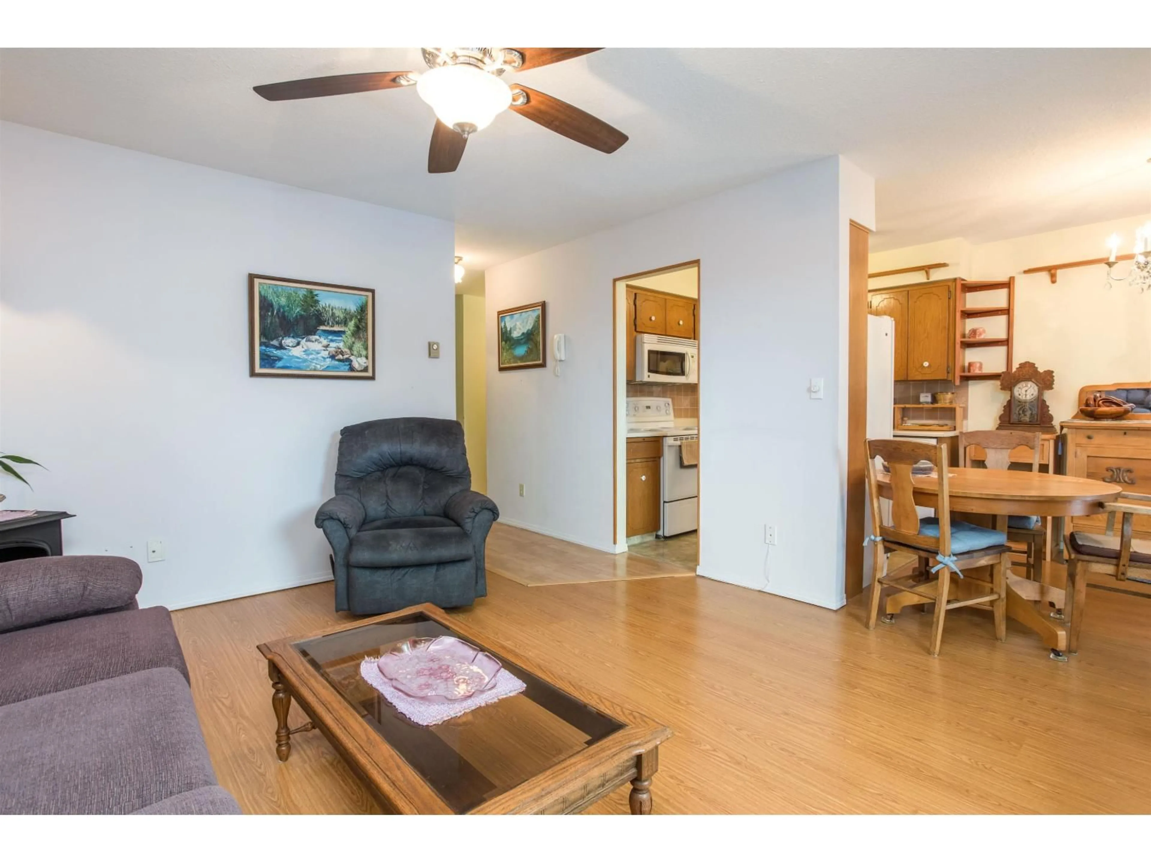 Living room with furniture, wood/laminate floor for 201 - 2853 BOURQUIN, Abbotsford British Columbia V2S6H6