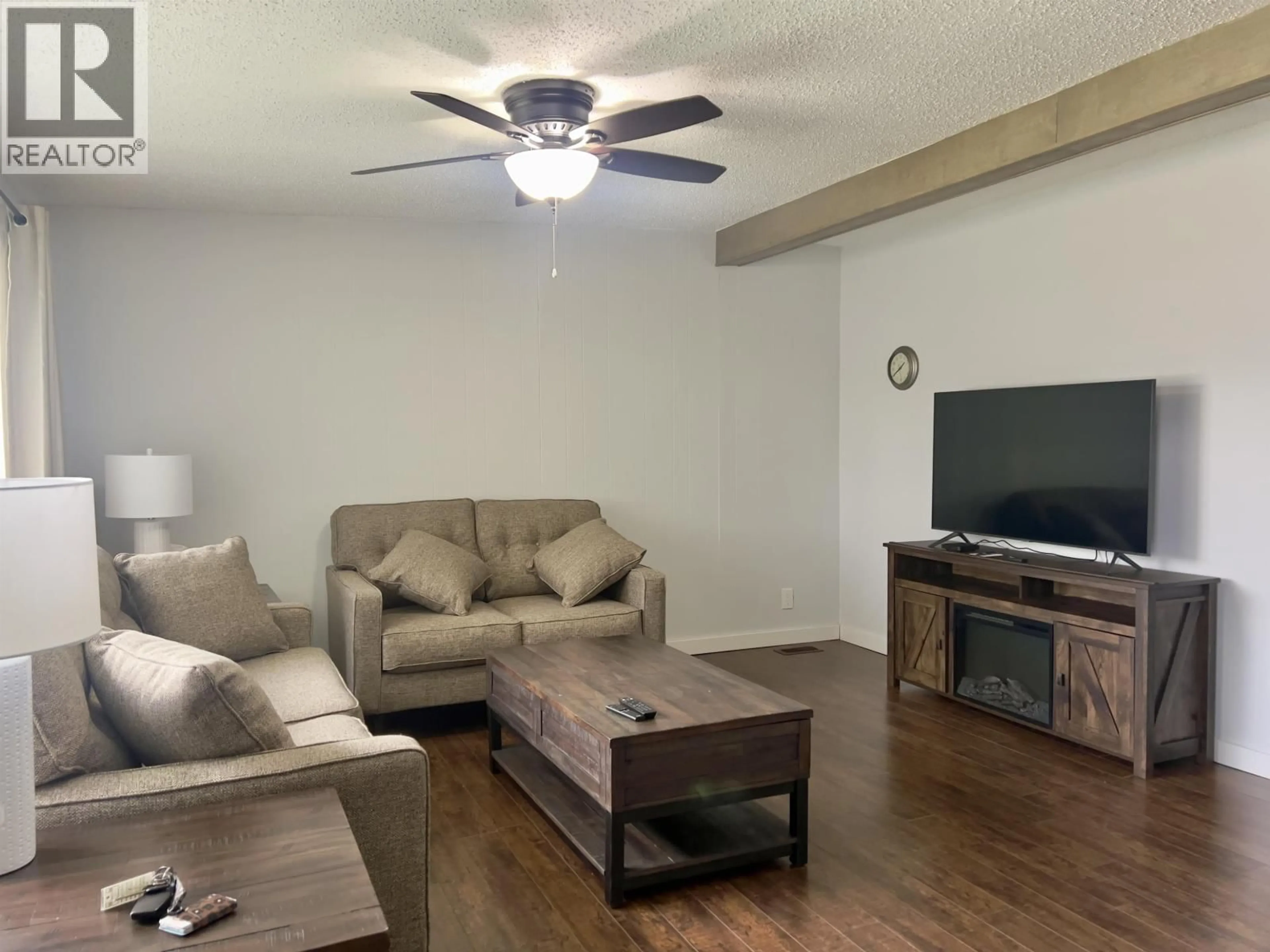 Living room with furniture, wood/laminate floor for 10 BAYER STREET, Kitimat British Columbia V8C2J9