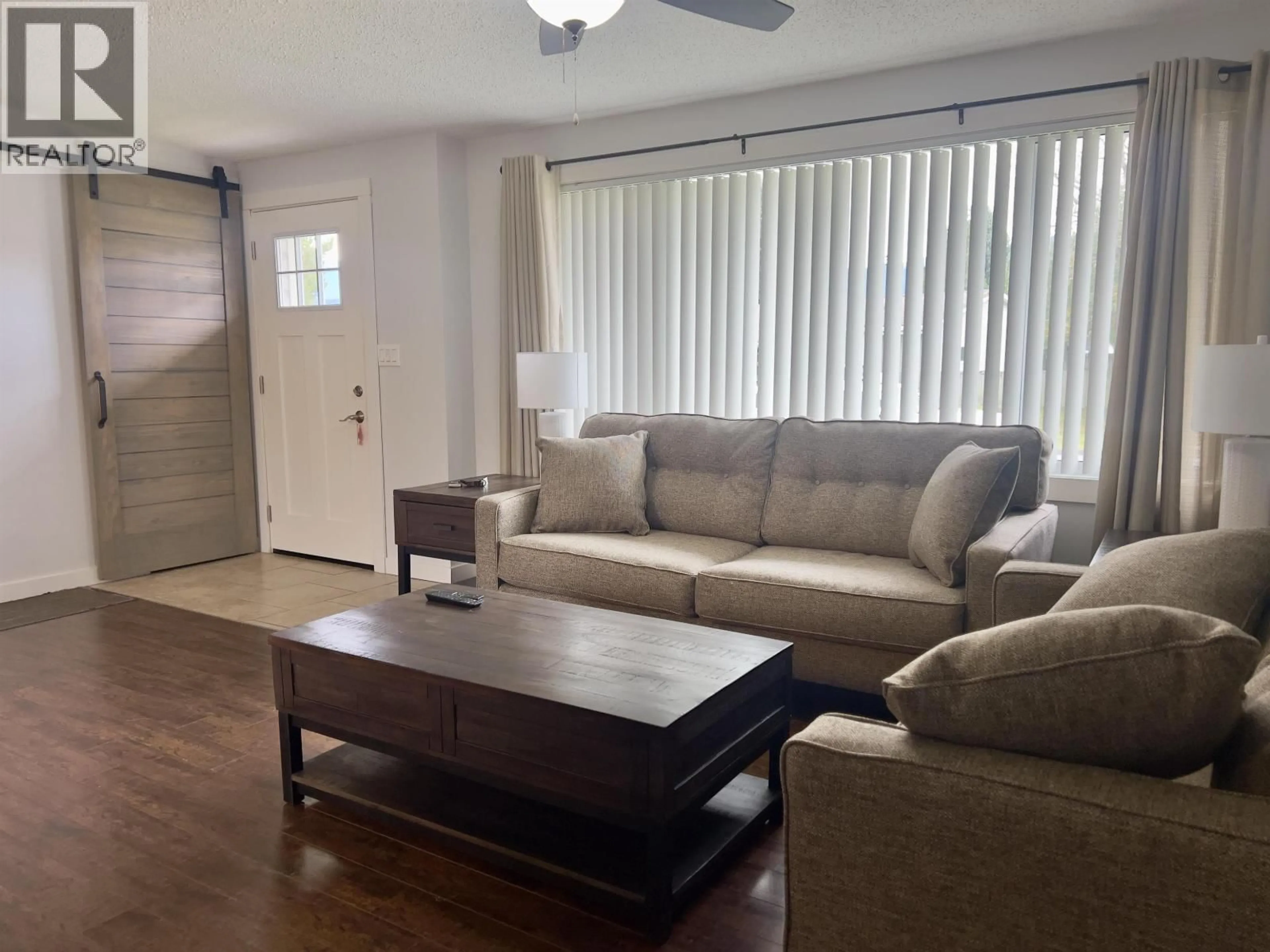Living room with furniture, wood/laminate floor for 10 BAYER STREET, Kitimat British Columbia V8C2J9