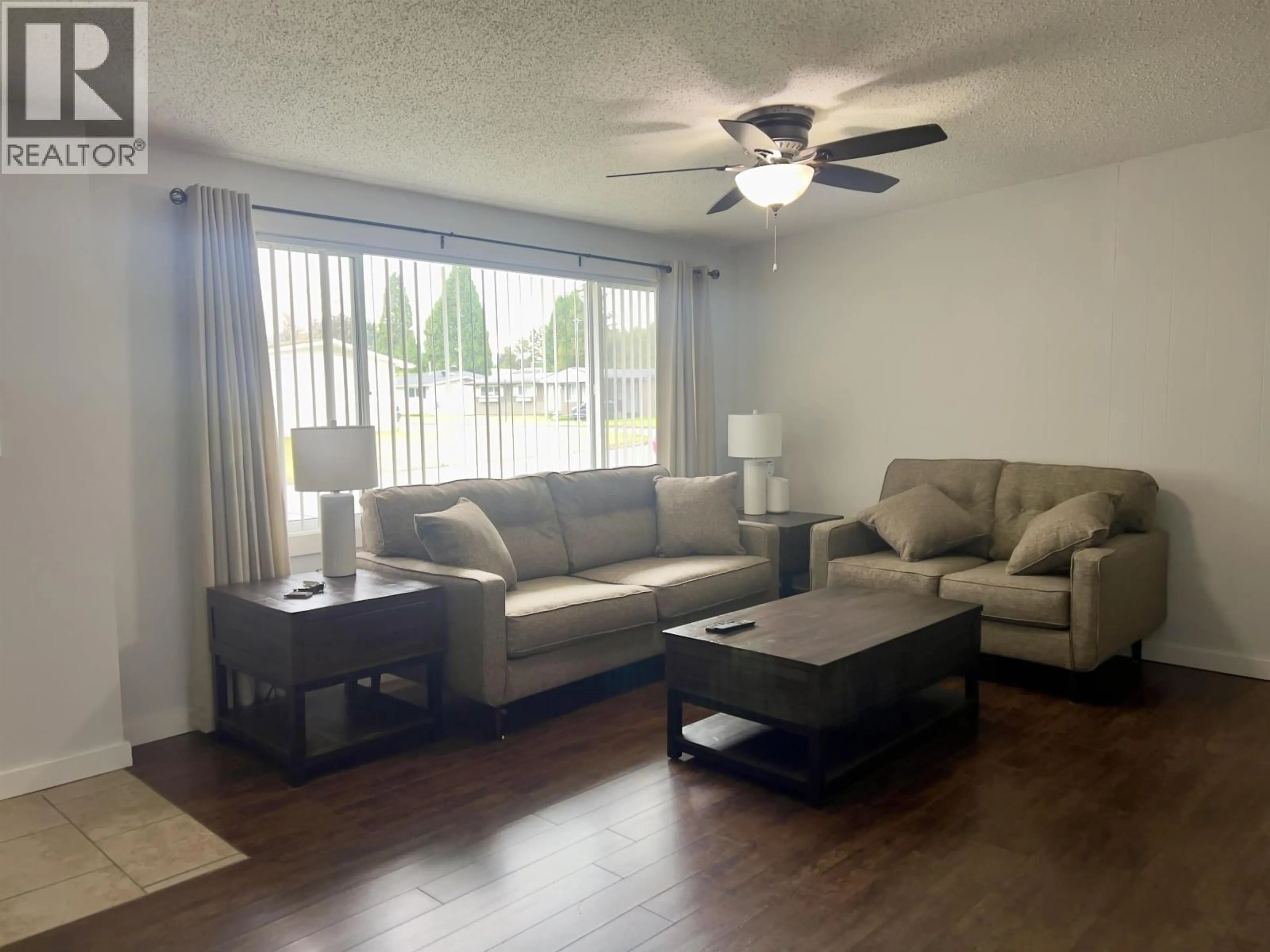 Living room with furniture, wood/laminate floor for 10 BAYER STREET, Kitimat British Columbia V8C2J9