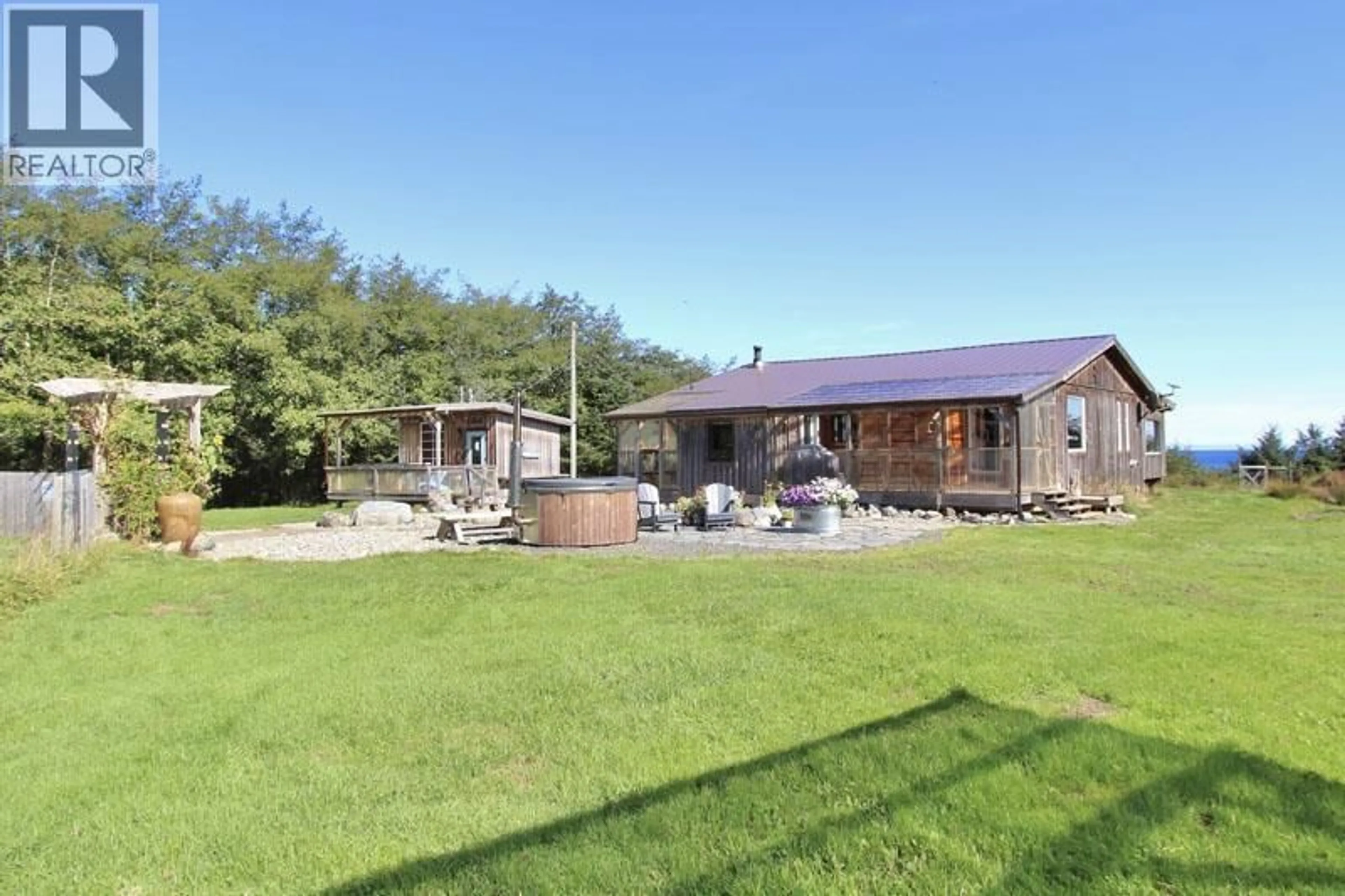 A pic from outside/outdoor area/front of a property/back of a property/a pic from drone, unknown for 31790 16 HIGHWAY, Daajing Giids City British Columbia V0T1Y0