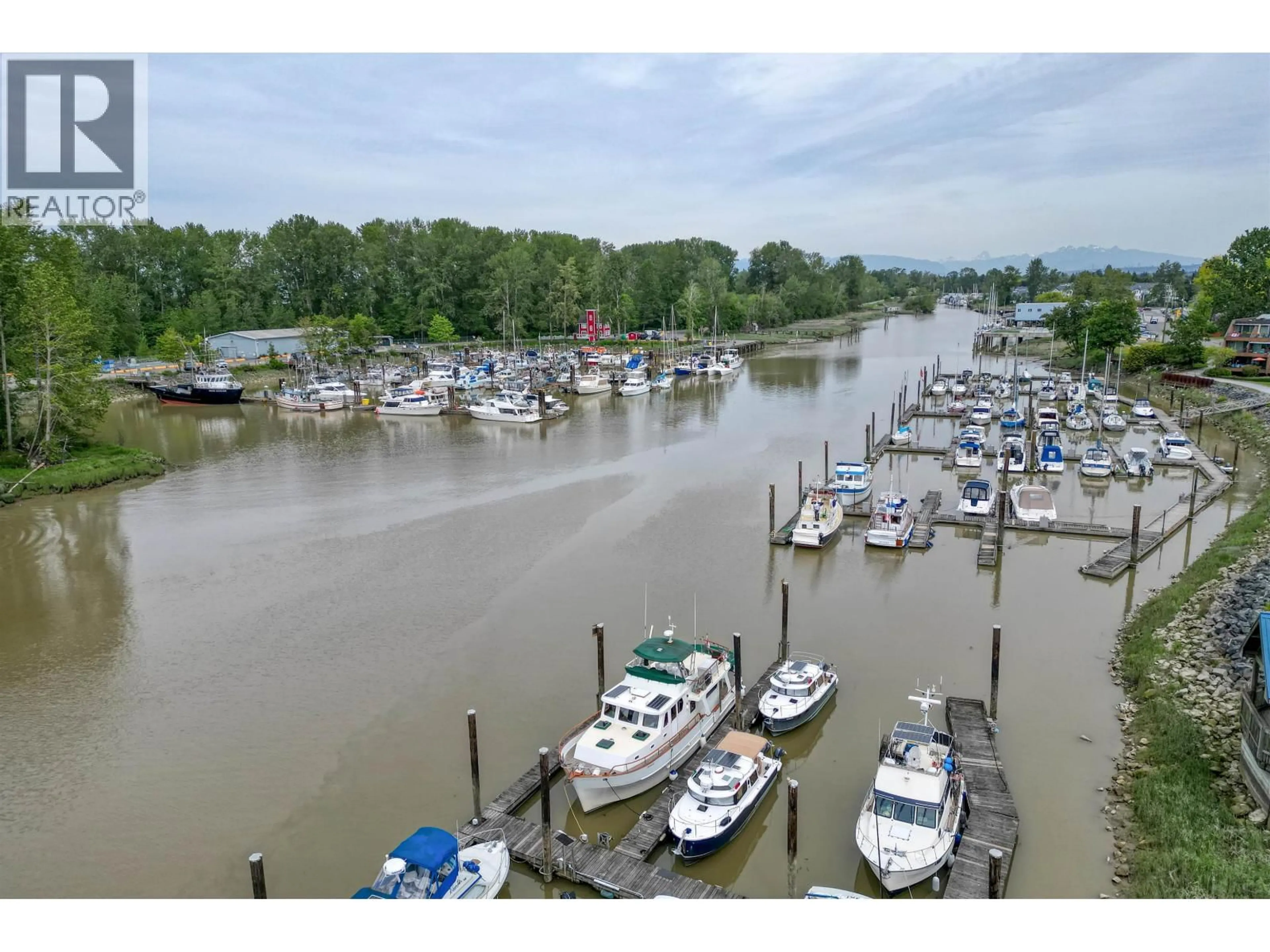 A pic from outside/outdoor area/front of a property/back of a property/a pic from drone, water/lake/river/ocean view for 304 - 4753 RIVER ROAD, Ladner British Columbia V4K1R9