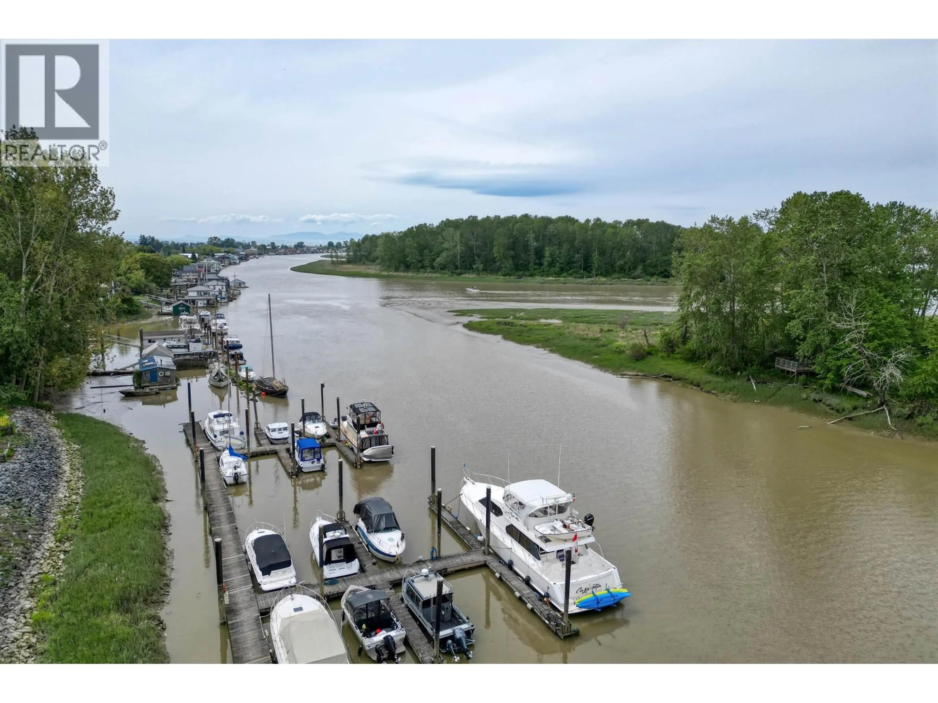 A pic from outside/outdoor area/front of a property/back of a property/a pic from drone, water/lake/river/ocean view for 304 - 4753 RIVER ROAD, Ladner British Columbia V4K1R9