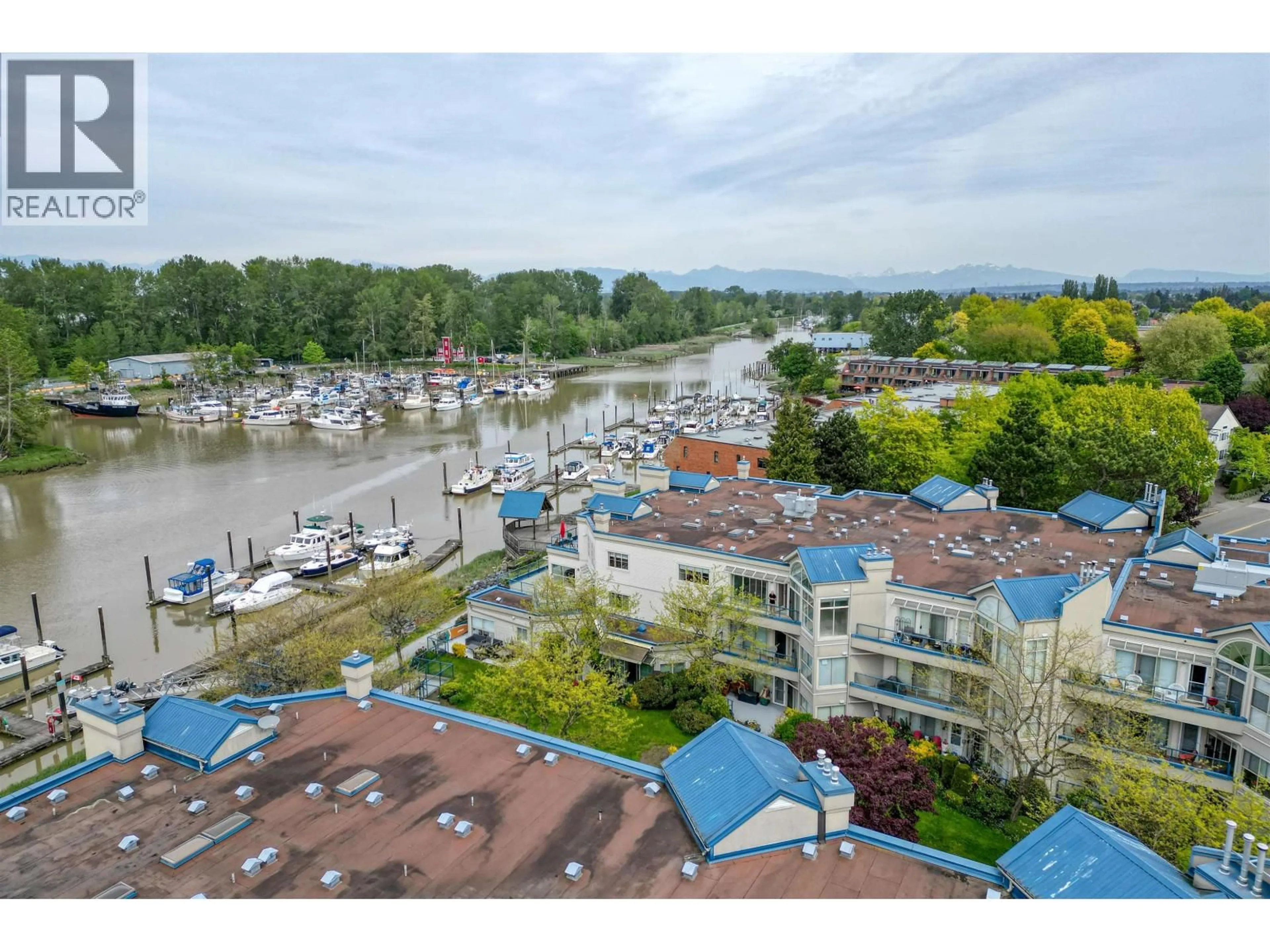 A pic from outside/outdoor area/front of a property/back of a property/a pic from drone, water/lake/river/ocean view for 304 - 4753 RIVER ROAD, Ladner British Columbia V4K1R9