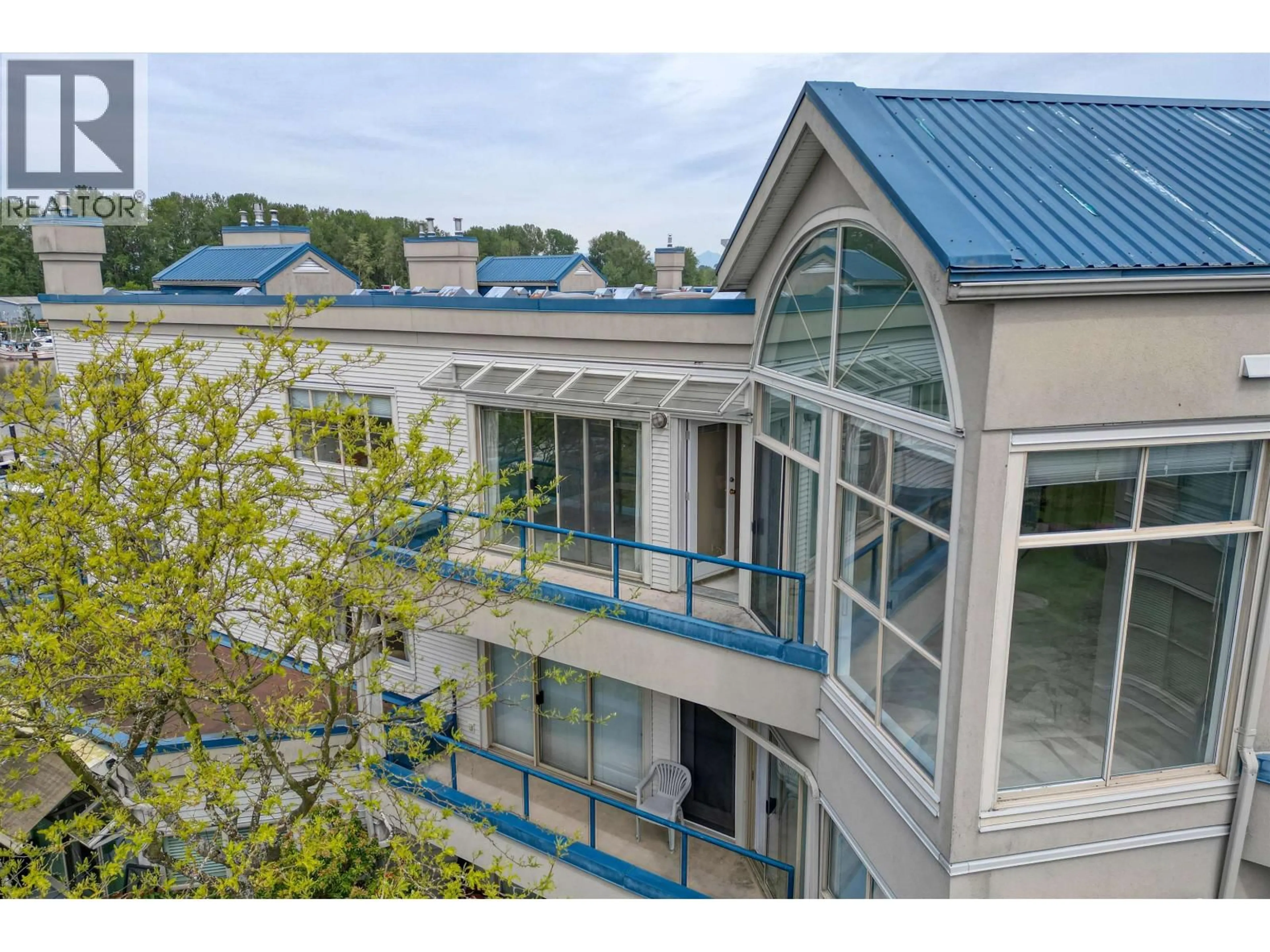 A pic from outside/outdoor area/front of a property/back of a property/a pic from drone, building for 304 - 4753 RIVER ROAD, Ladner British Columbia V4K1R9