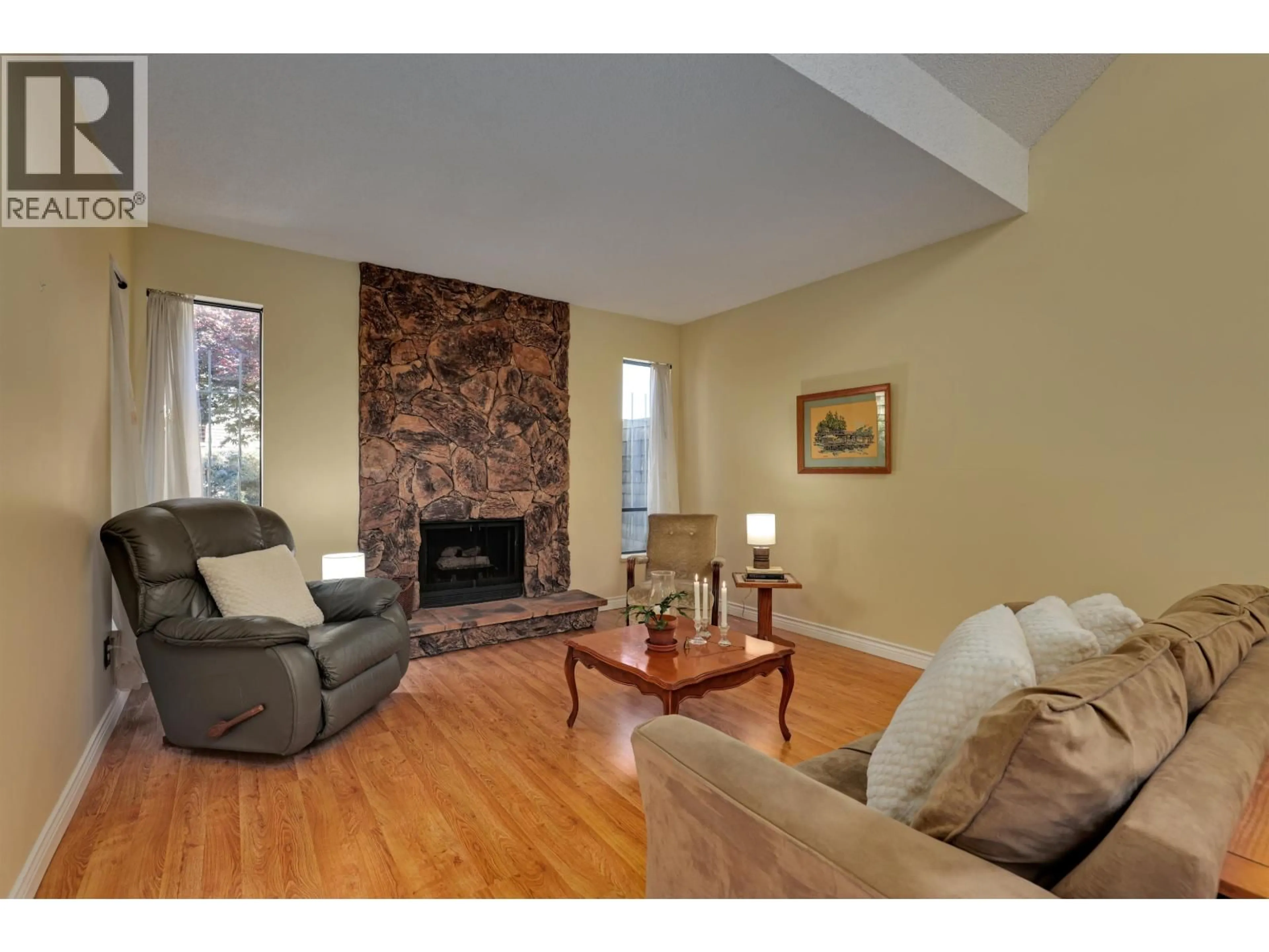 Living room with furniture, wood/laminate floor for 7847 MARCHWOOD PLACE, Vancouver British Columbia V5S4A6