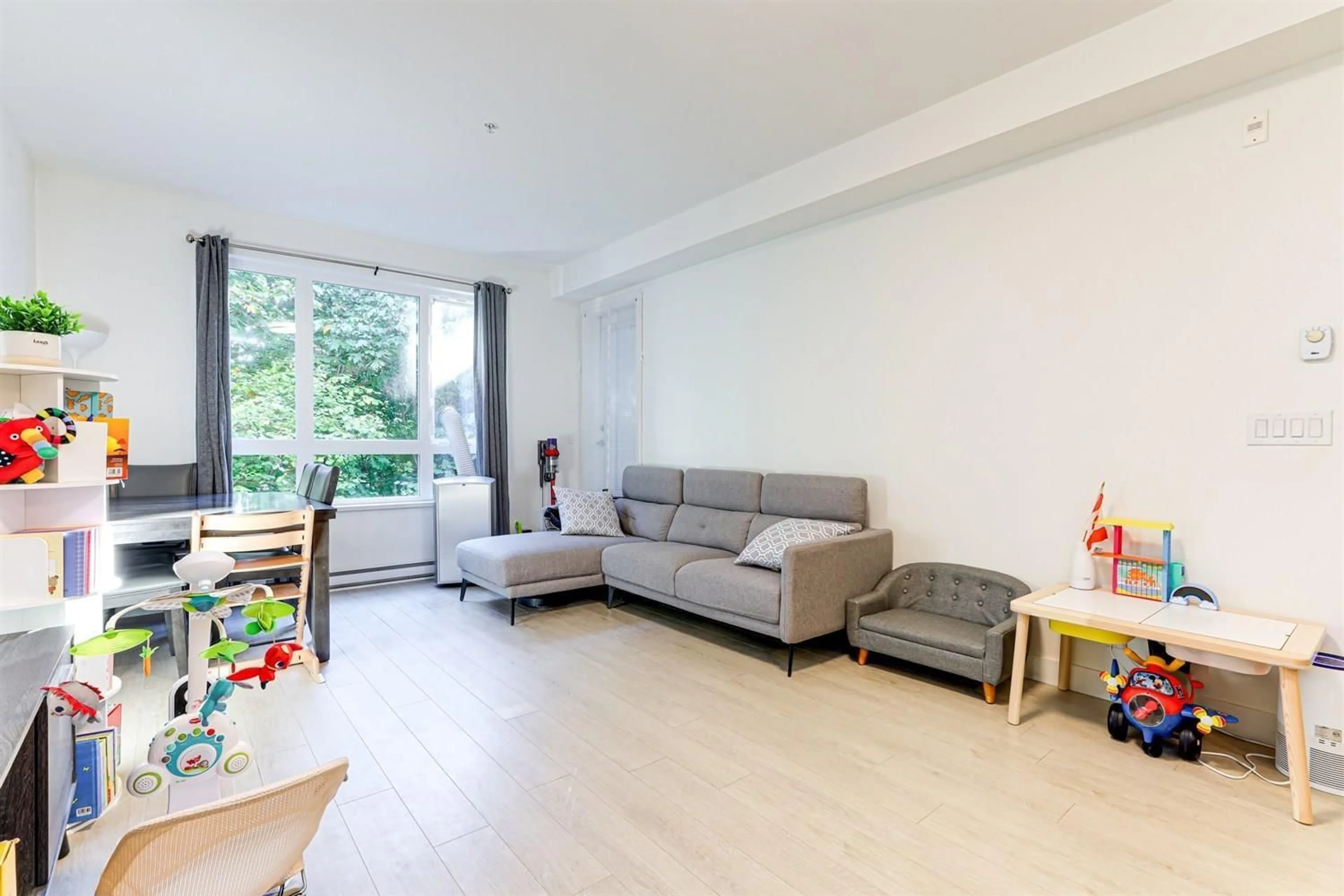 Living room with furniture, unknown for 205 - 13925 FRASER, Surrey British Columbia V3T4E6