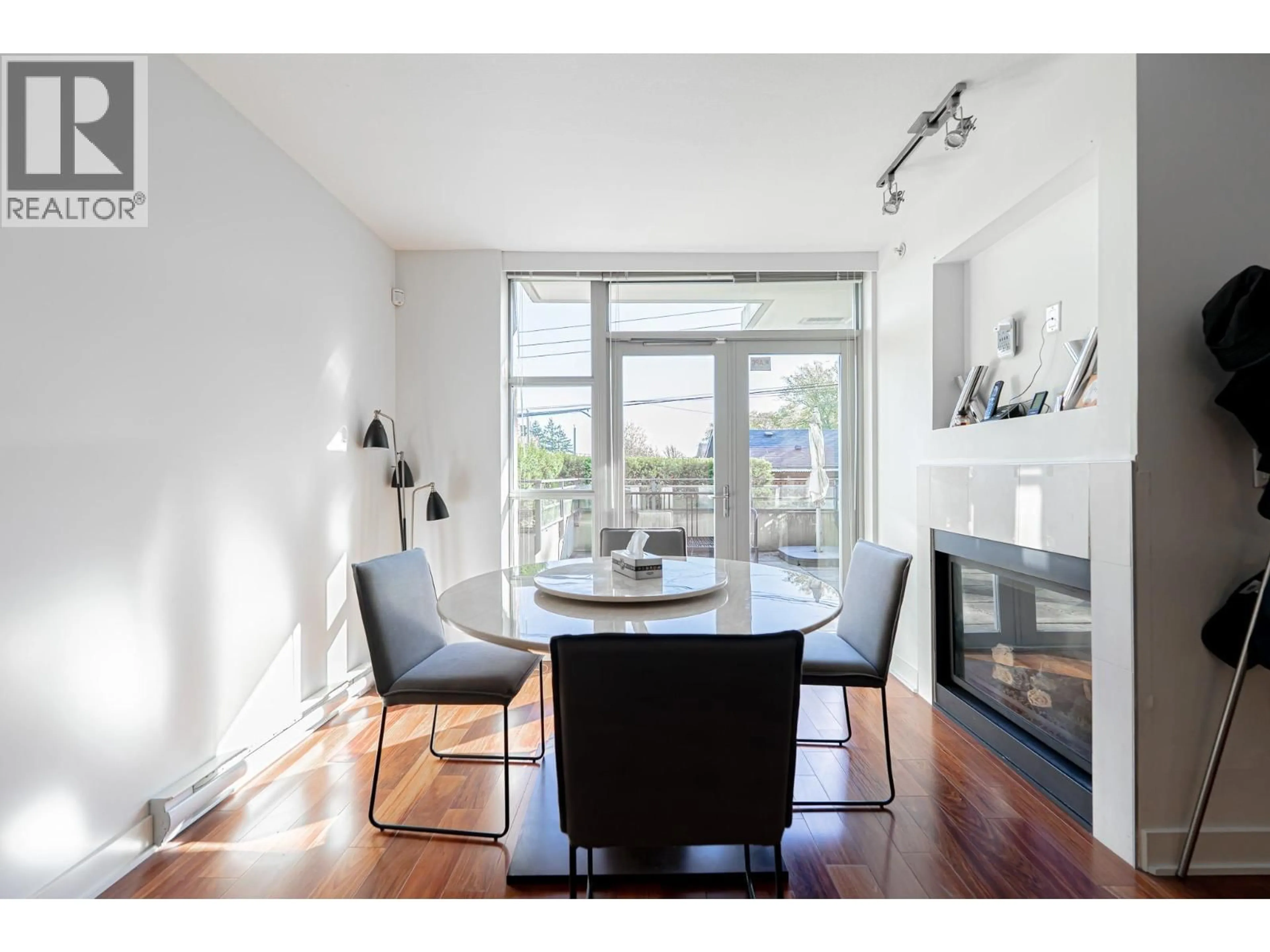 Dining room, wood/laminate floor for 104 - 3595 18TH AVENUE, Vancouver British Columbia V6S1A9