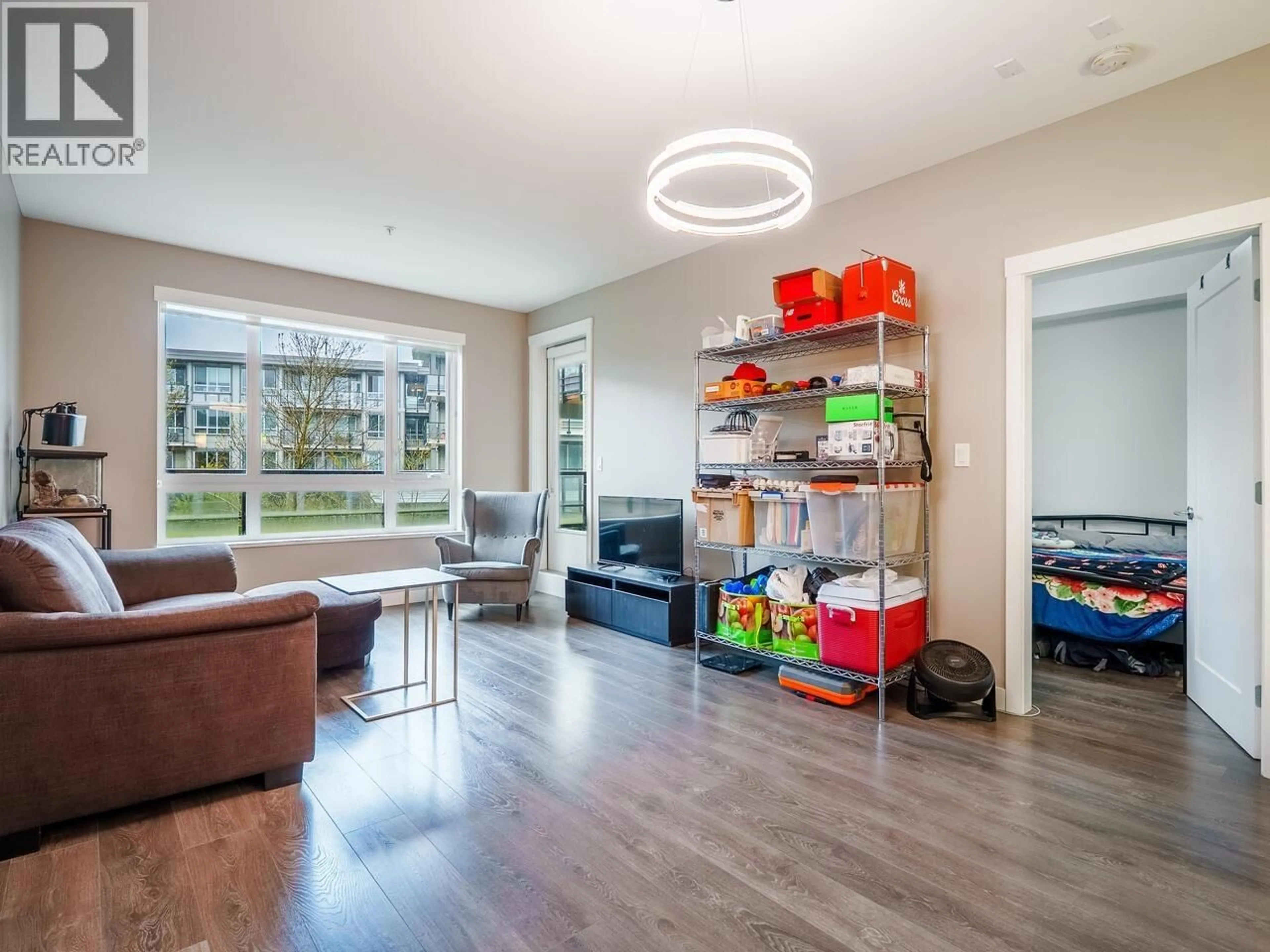 Living room with furniture, wood/laminate floor for 220 - 23233 GILLEY ROAD, Richmond British Columbia V6V1E6