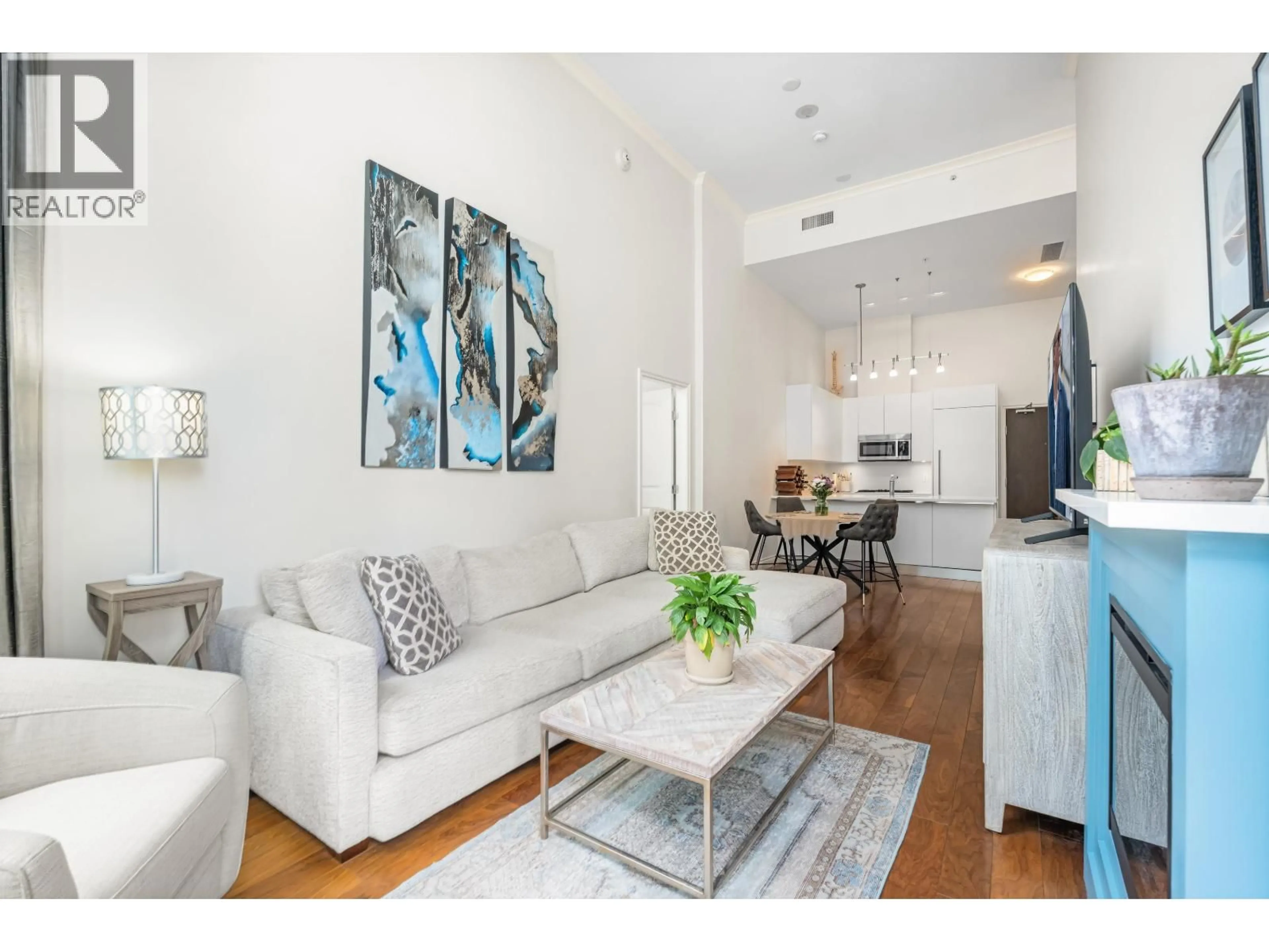 Living room with furniture, unknown for 104 - 199 VICTORY SHIP WAY, North Vancouver British Columbia V9L0E2