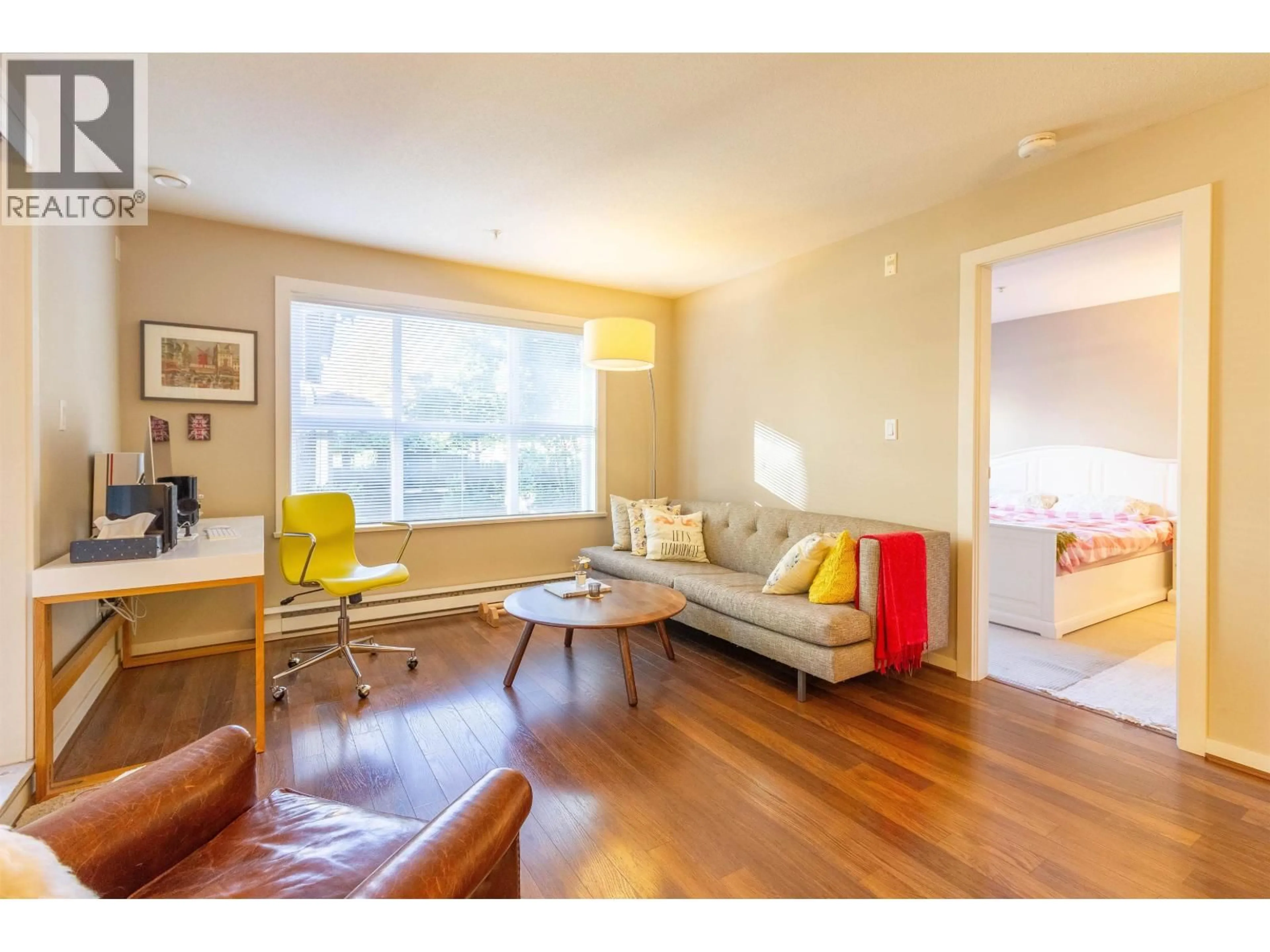 Living room with furniture, wood/laminate floor for 108 - 5889 IRMIN STREET, Burnaby British Columbia V5J0C1