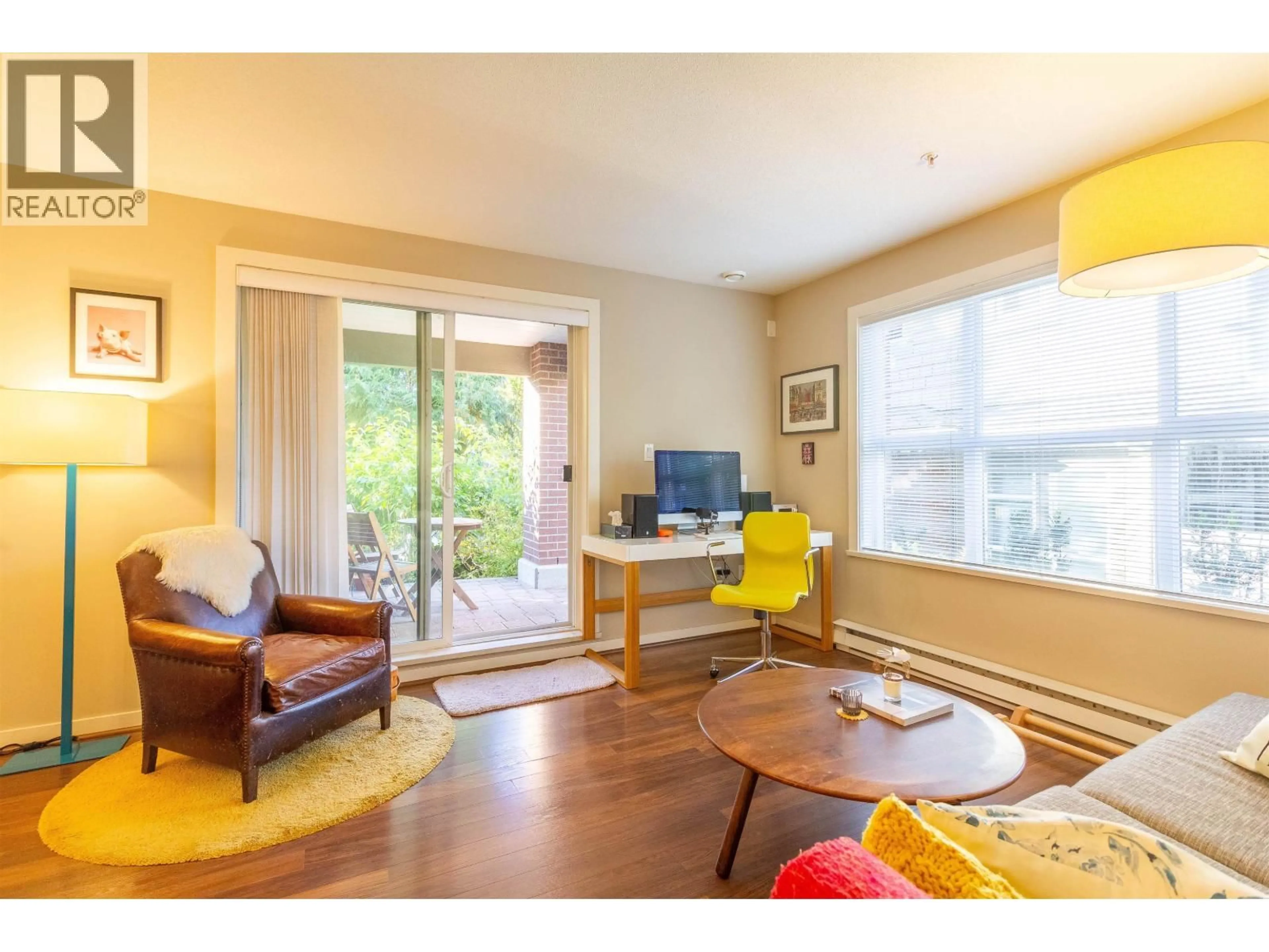 Living room with furniture, wood/laminate floor for 108 - 5889 IRMIN STREET, Burnaby British Columbia V5J0C1