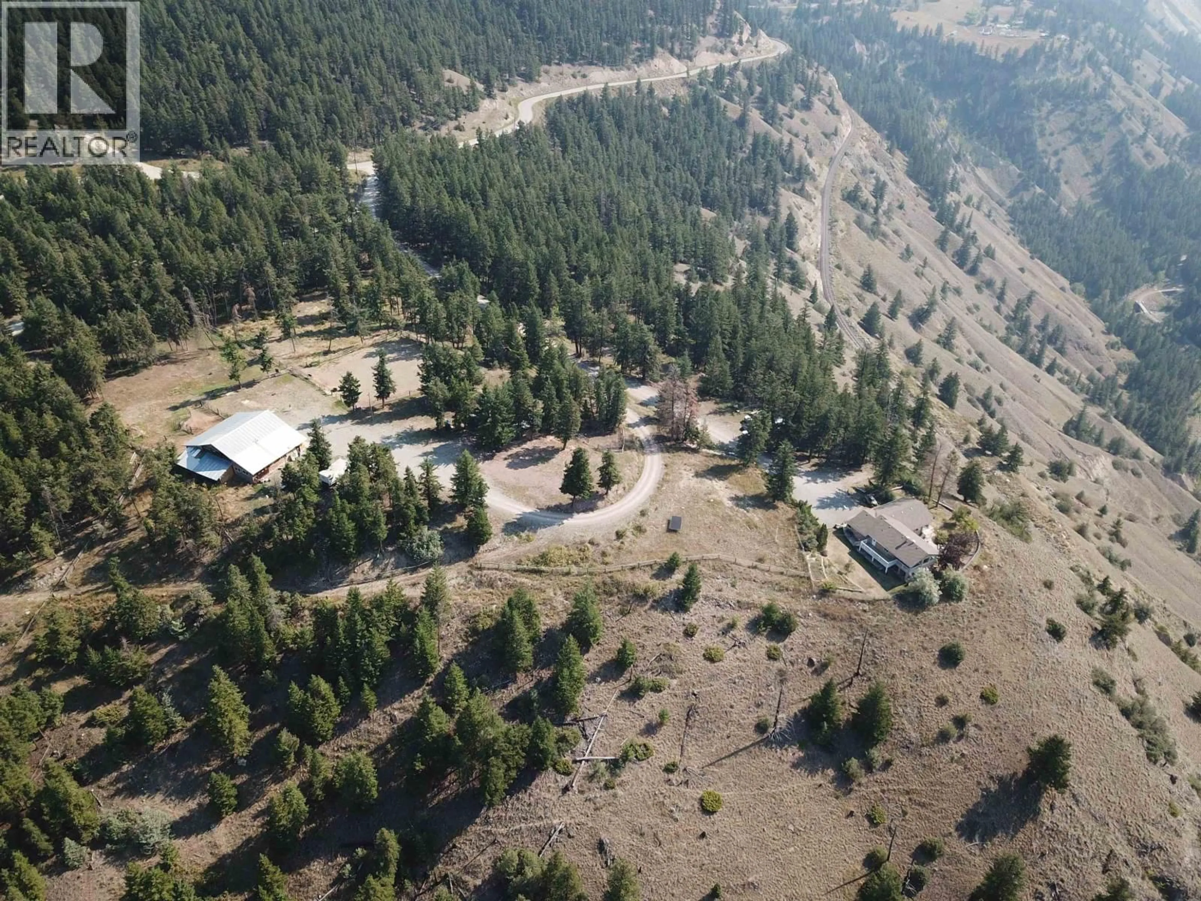 A pic from outside/outdoor area/front of a property/back of a property/a pic from drone, mountain view for 1121 SODA CREEK ROAD, Williams Lake British Columbia V2G5E4