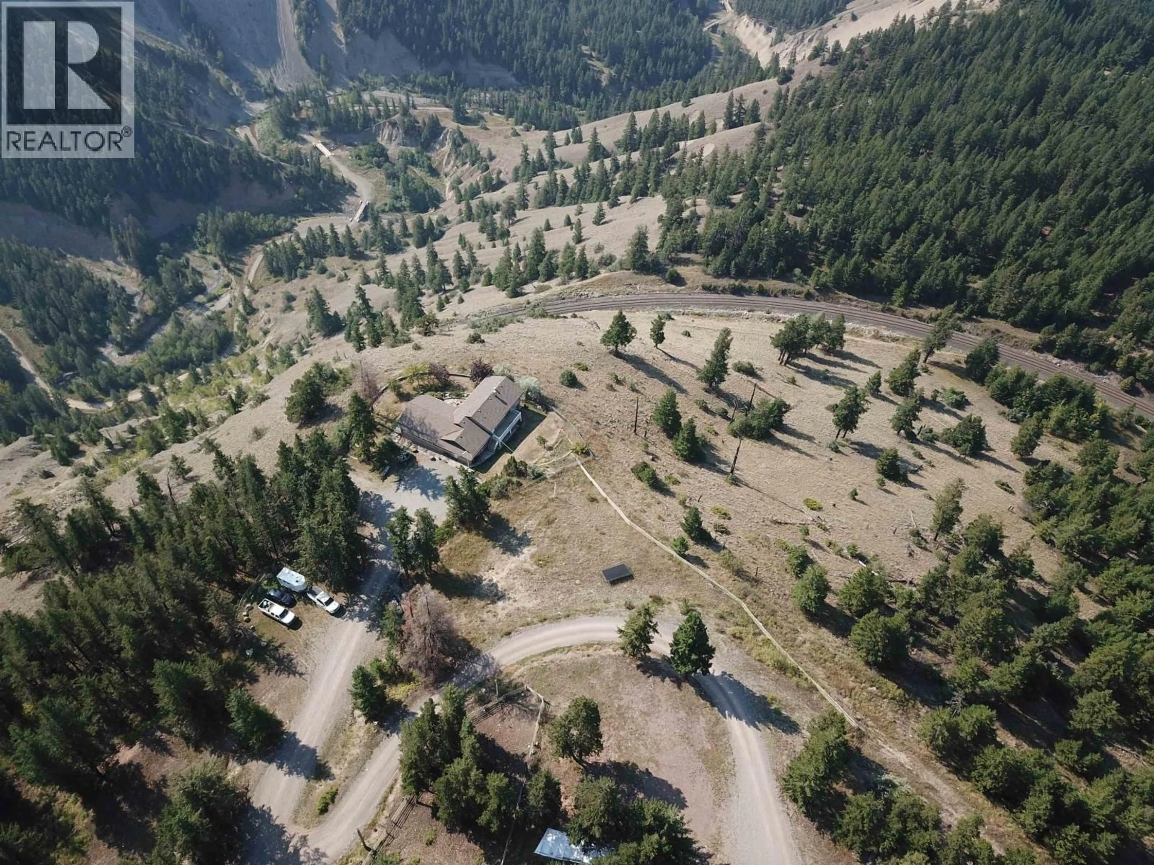 A pic from outside/outdoor area/front of a property/back of a property/a pic from drone, mountain view for 1121 SODA CREEK ROAD, Williams Lake British Columbia V2G5E4