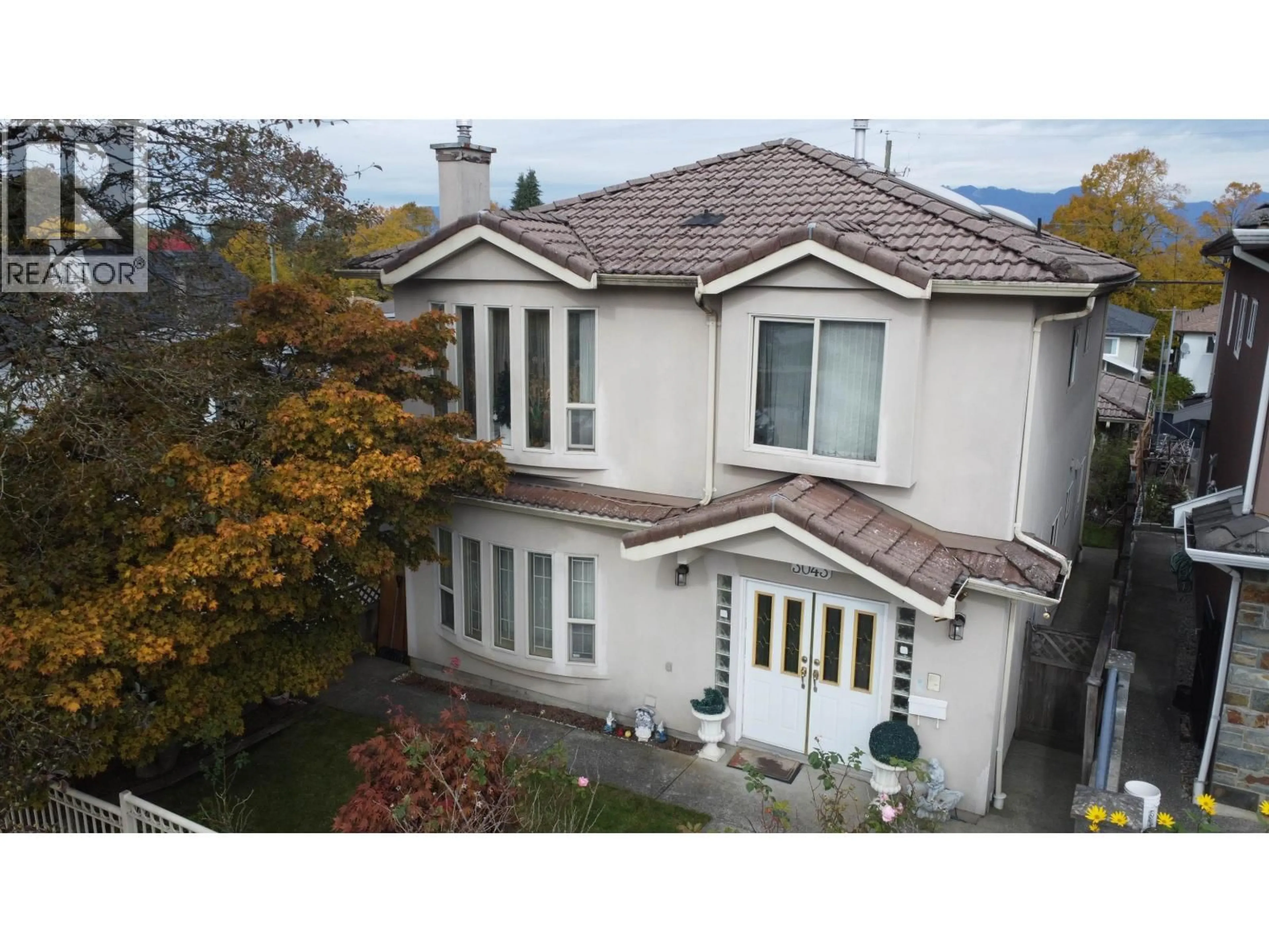 A pic from outside/outdoor area/front of a property/back of a property/a pic from drone, street for 3043 29TH AVENUE, Vancouver British Columbia V5R1V9