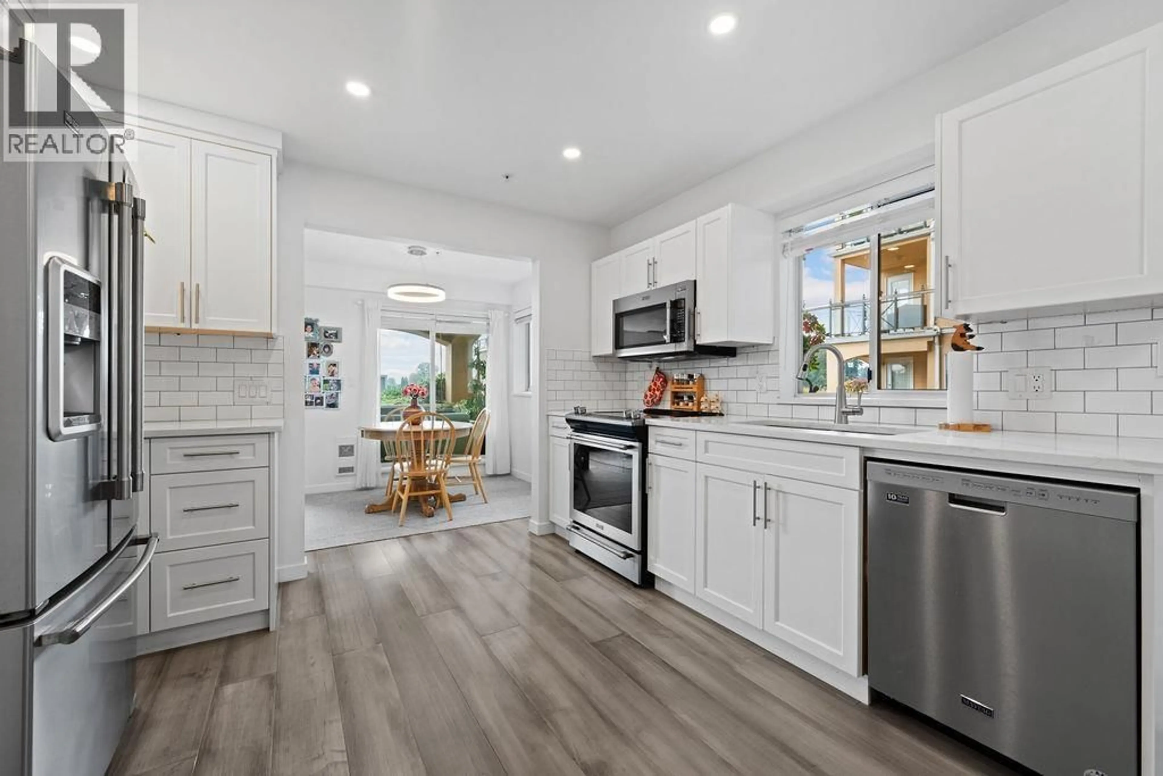 Open concept kitchen, ceramic/tile floor for 111 - 6 RENAISSANCE SQUARE, New Westminster British Columbia V3M6N8