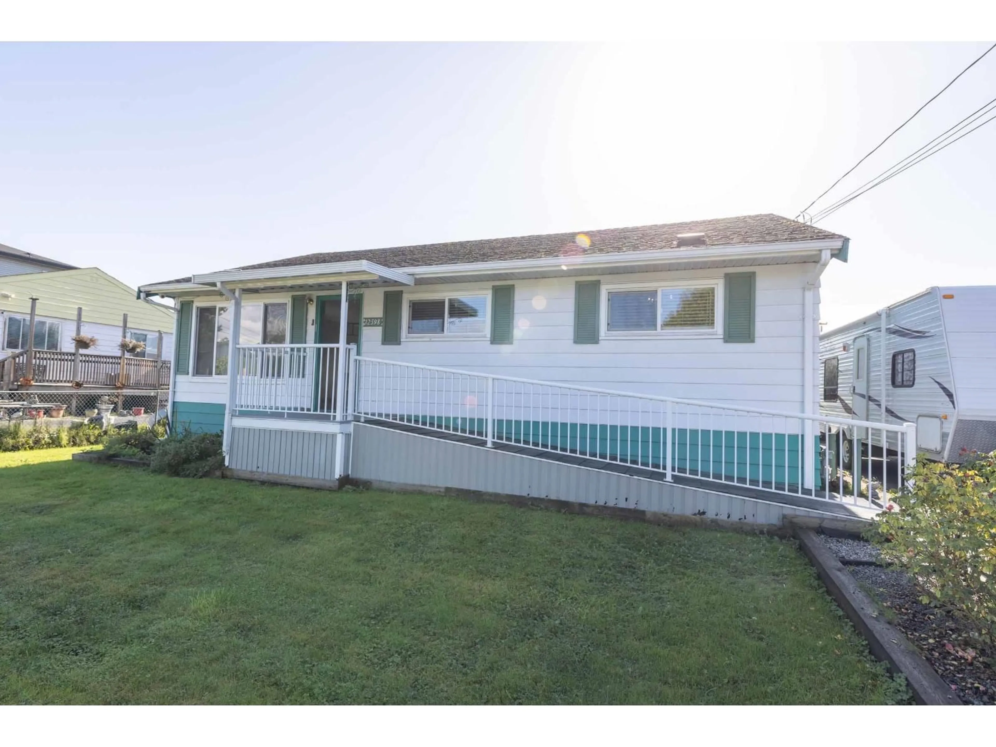 Home with vinyl exterior material, street for 12598 113, Surrey British Columbia V3V3M2