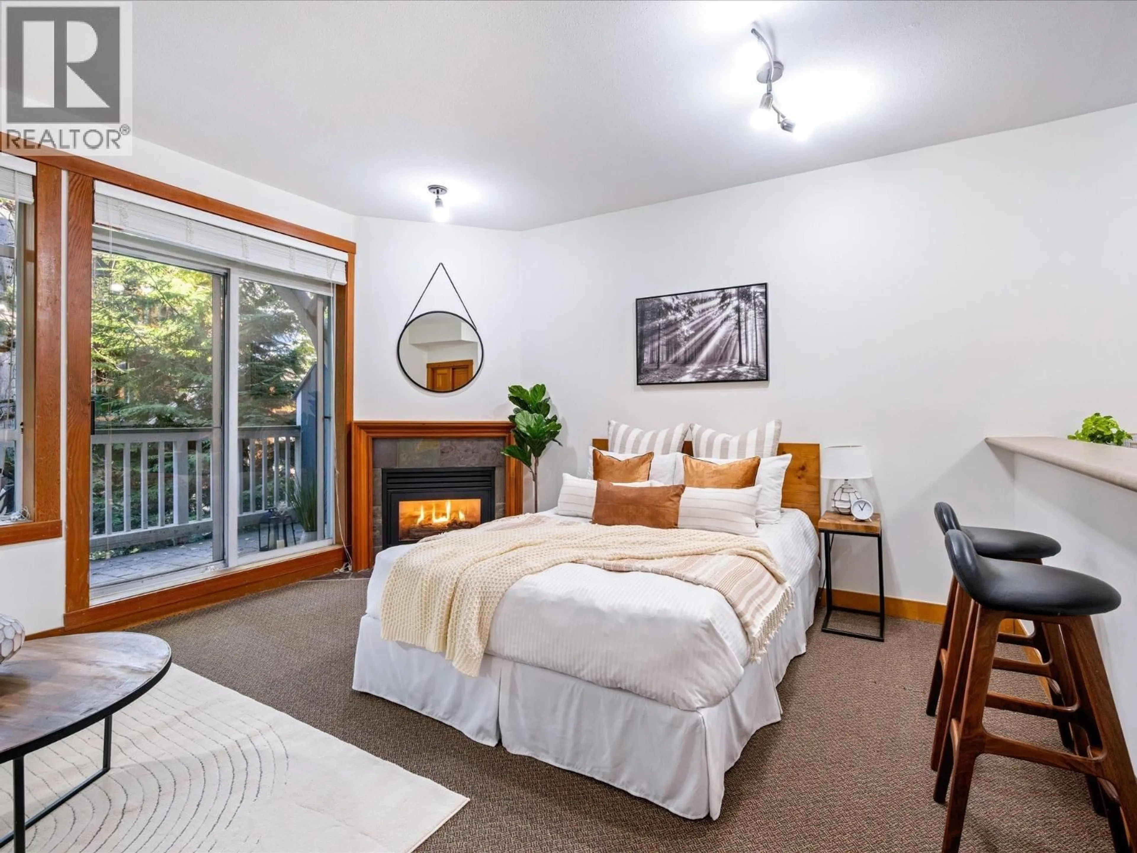 Bedroom with bed, wood/laminate floor for 204 - 4405 BLACKCOMB WAY, Whistler British Columbia V8E0X7