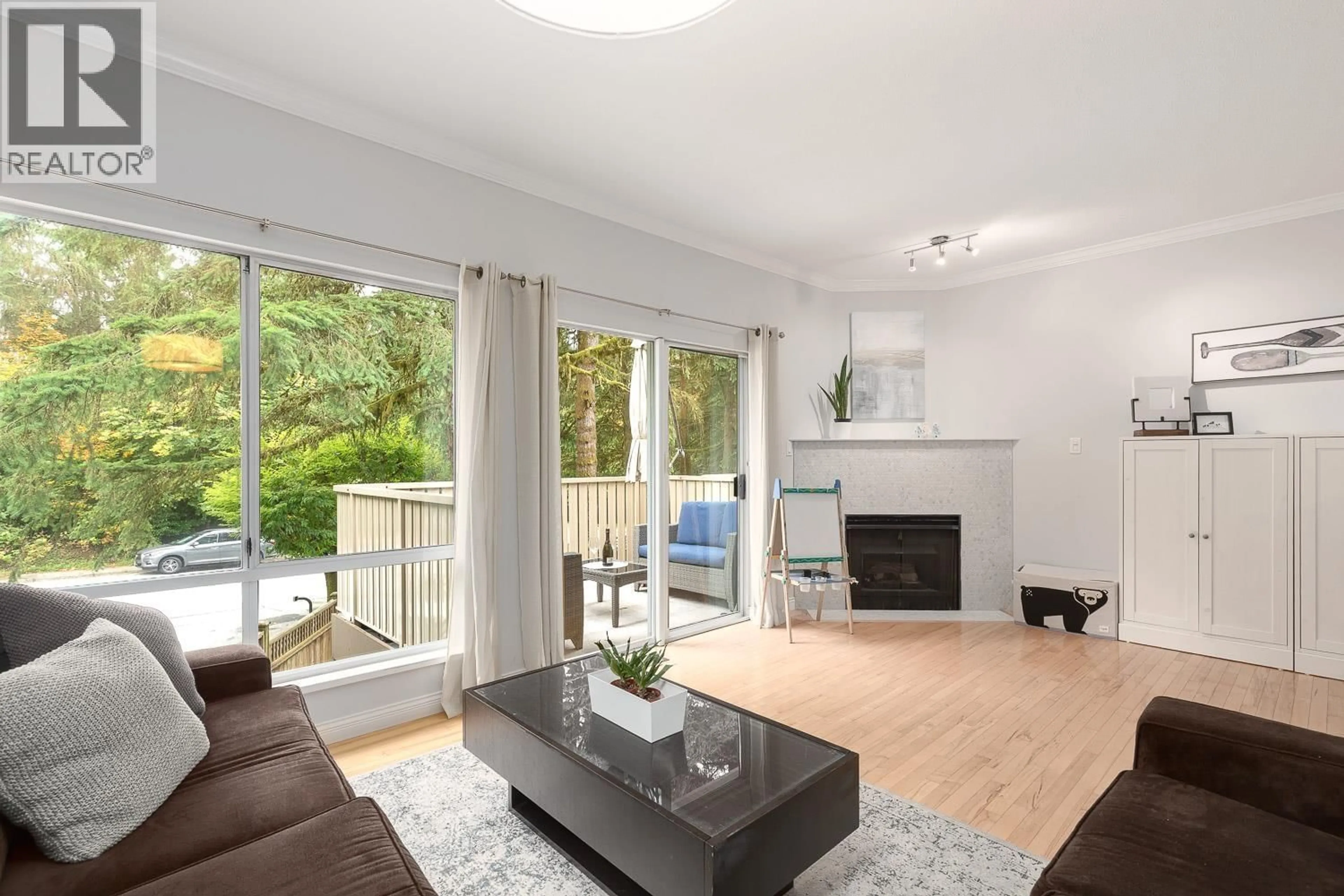 Living room with furniture, wood/laminate floor for 63 - 3939 INDIAN RIVER DRIVE, North Vancouver British Columbia V7G2P6