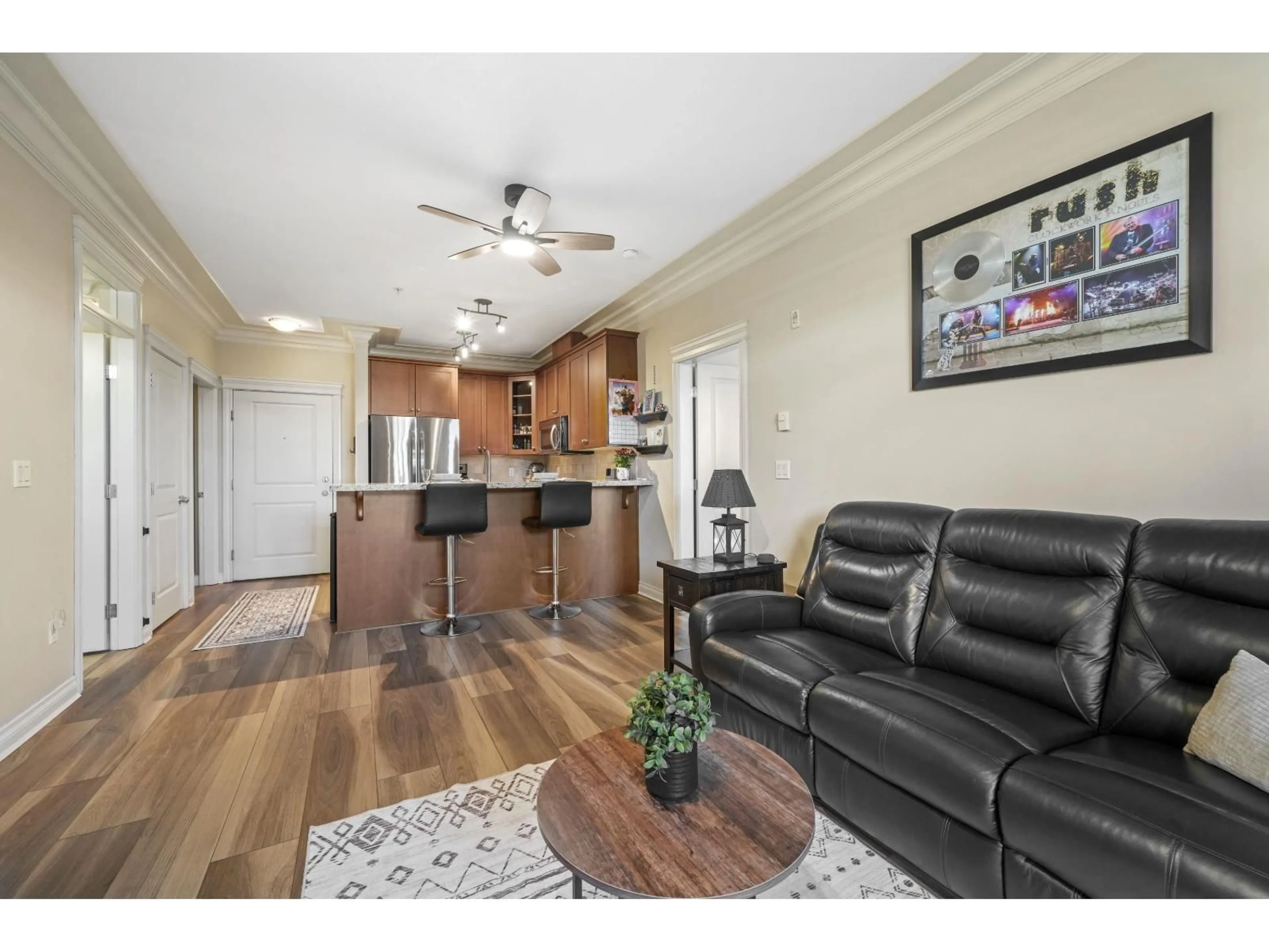 Living room with furniture, wood/laminate floor for 222 - 32729 GARIBALDI, Abbotsford British Columbia V2T0A6