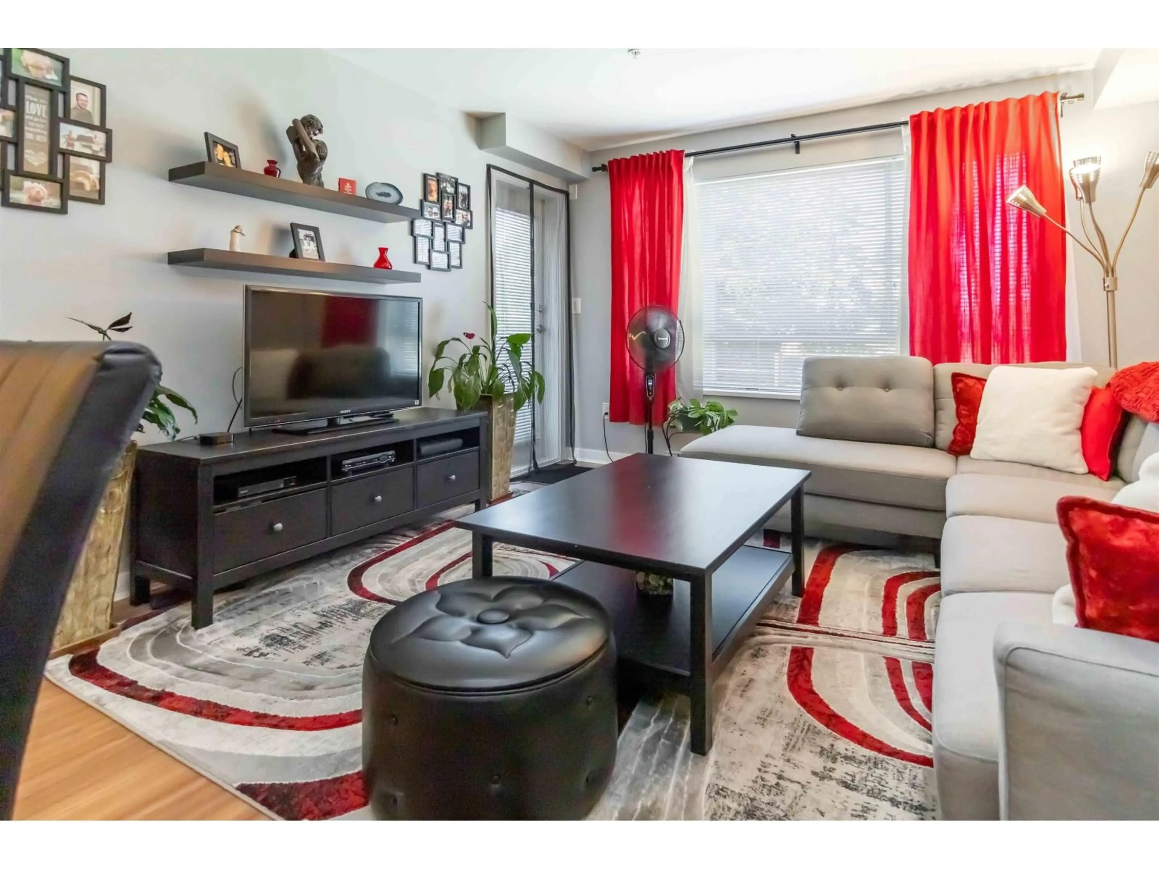 Living room with furniture, wood/laminate floor for 309 - 7511 120, Delta British Columbia V4C0C1