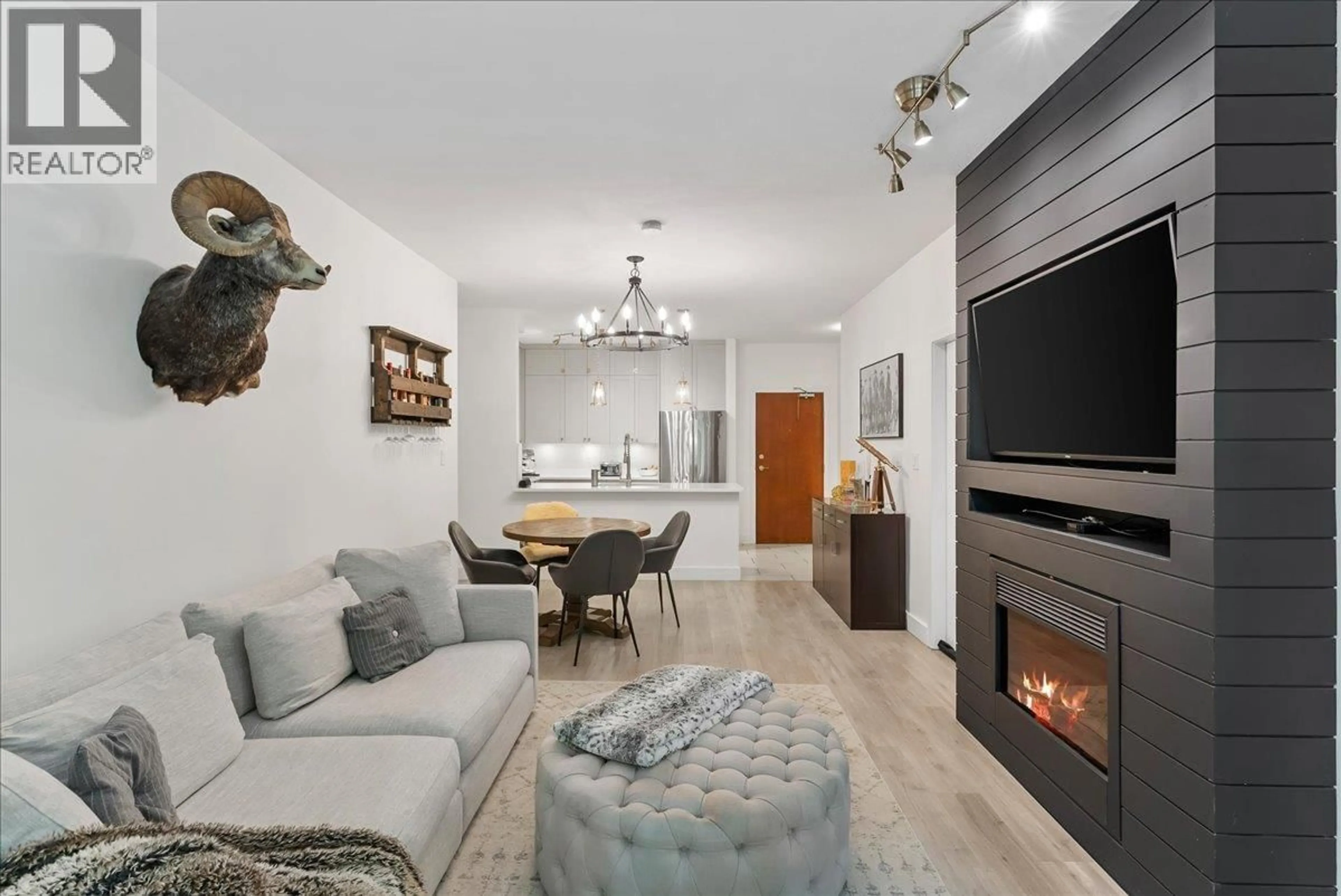 Living room with furniture, unknown for 106 - 200 CAPILANO ROAD, Port Moody British Columbia V3H5N1