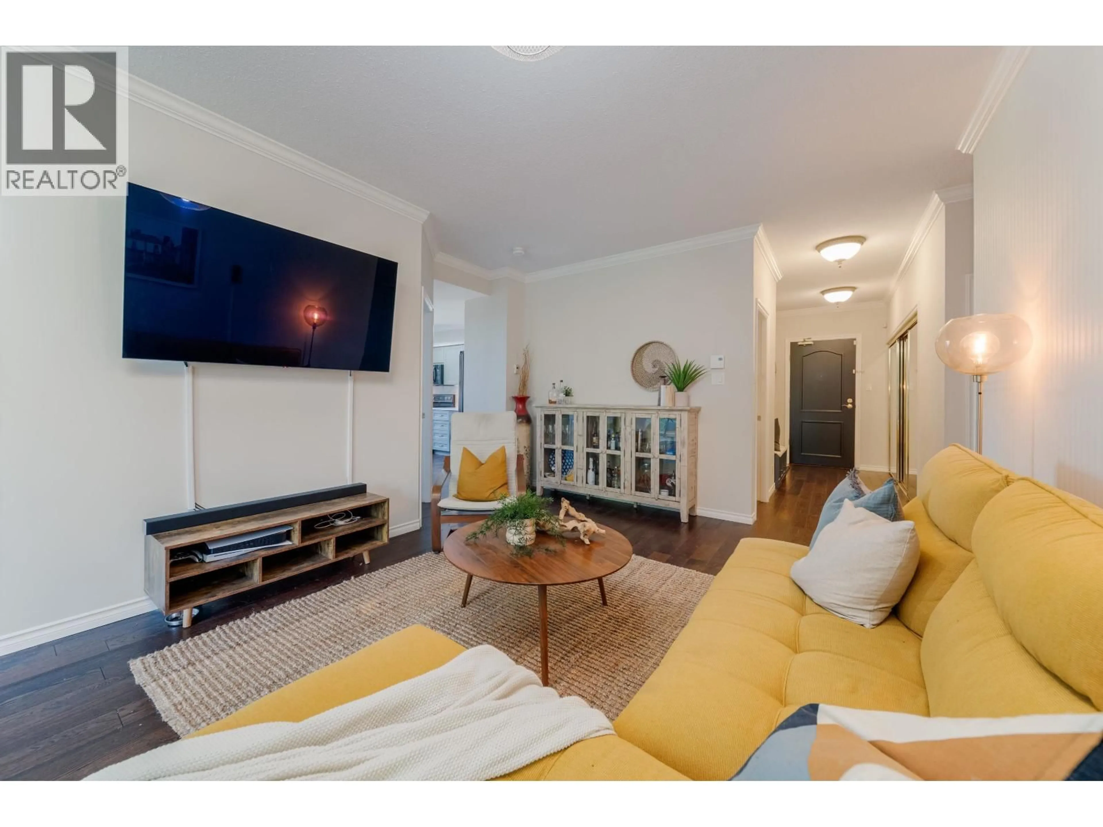 Living room with furniture, wood/laminate floor for 304 - 6888 STATION HILL DRIVE, Burnaby British Columbia V3N4X5