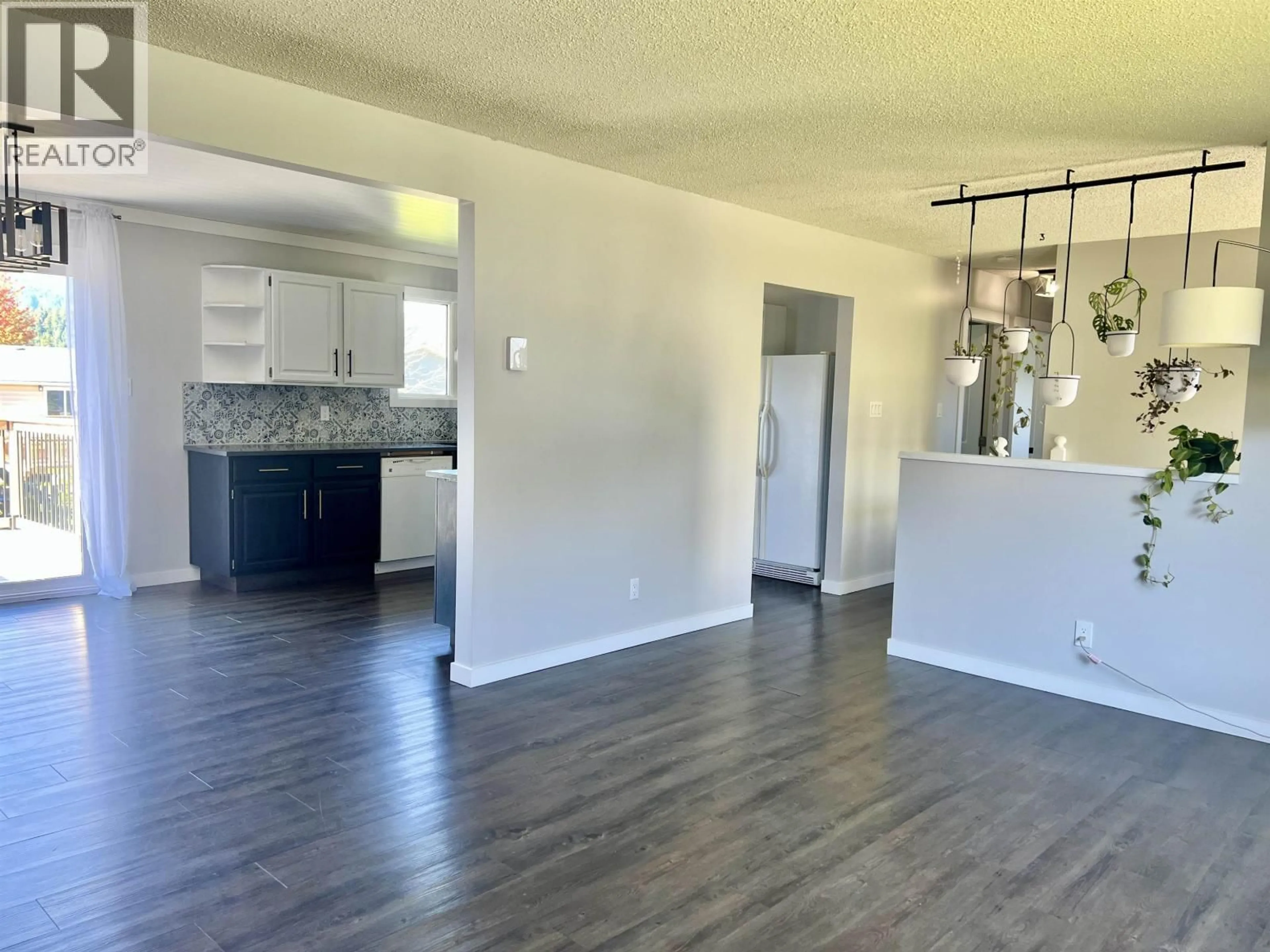 Open concept kitchen, wood/laminate floor for 104 CHARLES STREET, Kitimat British Columbia V8C2J3