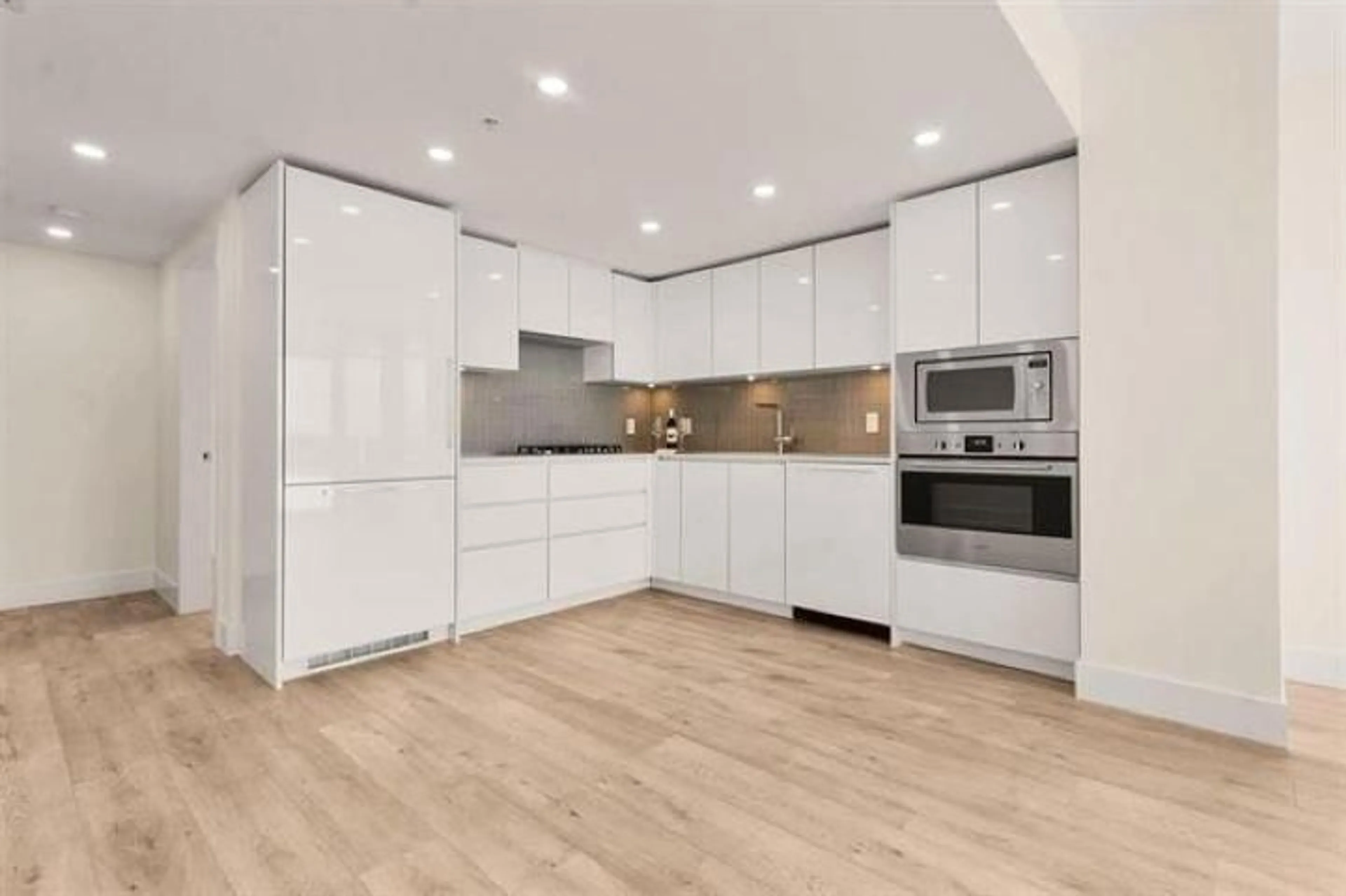 Open concept kitchen, wood/laminate floor for 2502 - 10428 WHALLEY BOULEVARD NORTH, Surrey British Columbia V3T1W6