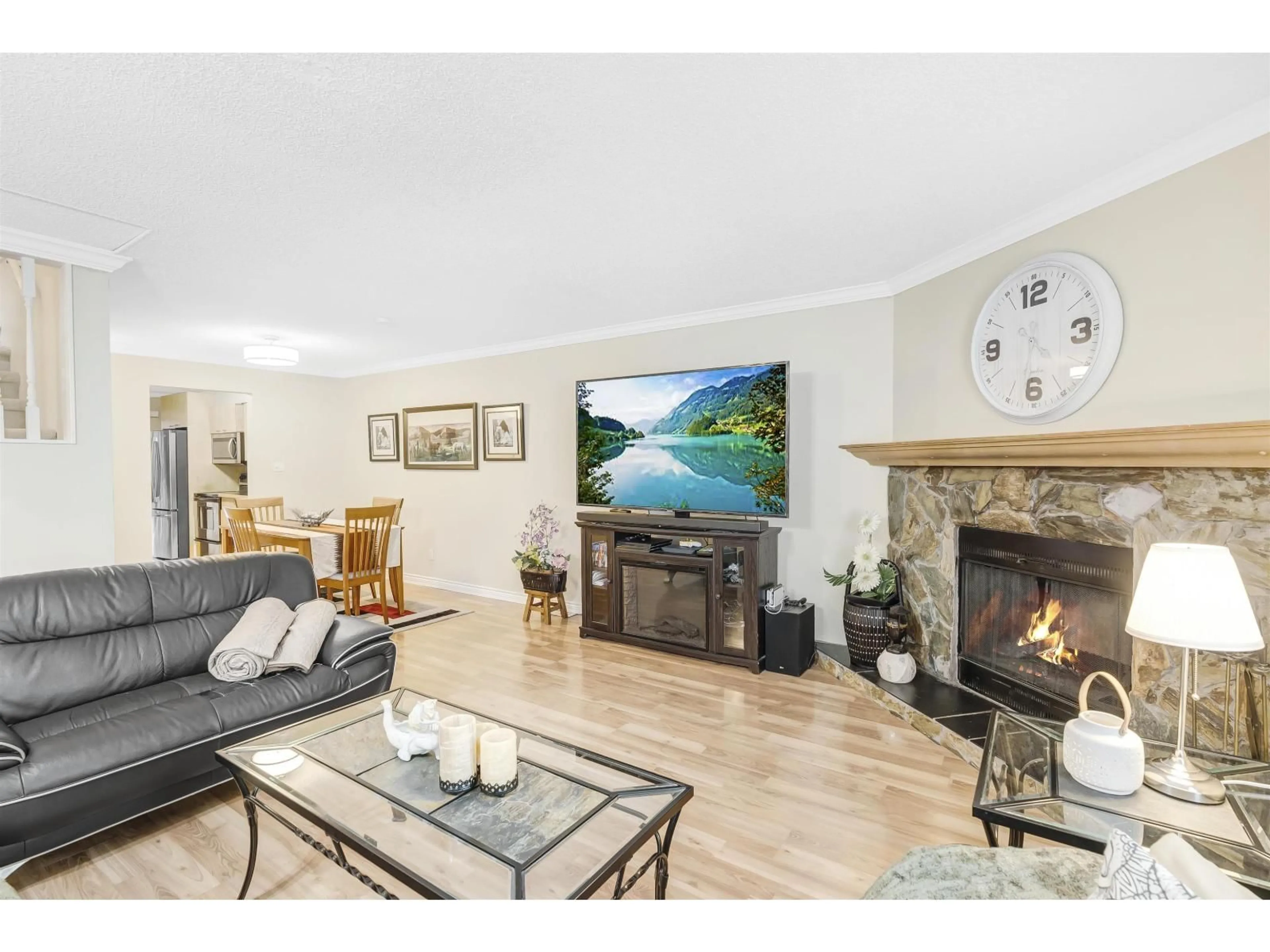 Living room with furniture, wood/laminate floor for 14783 101, Surrey British Columbia V3R7H7