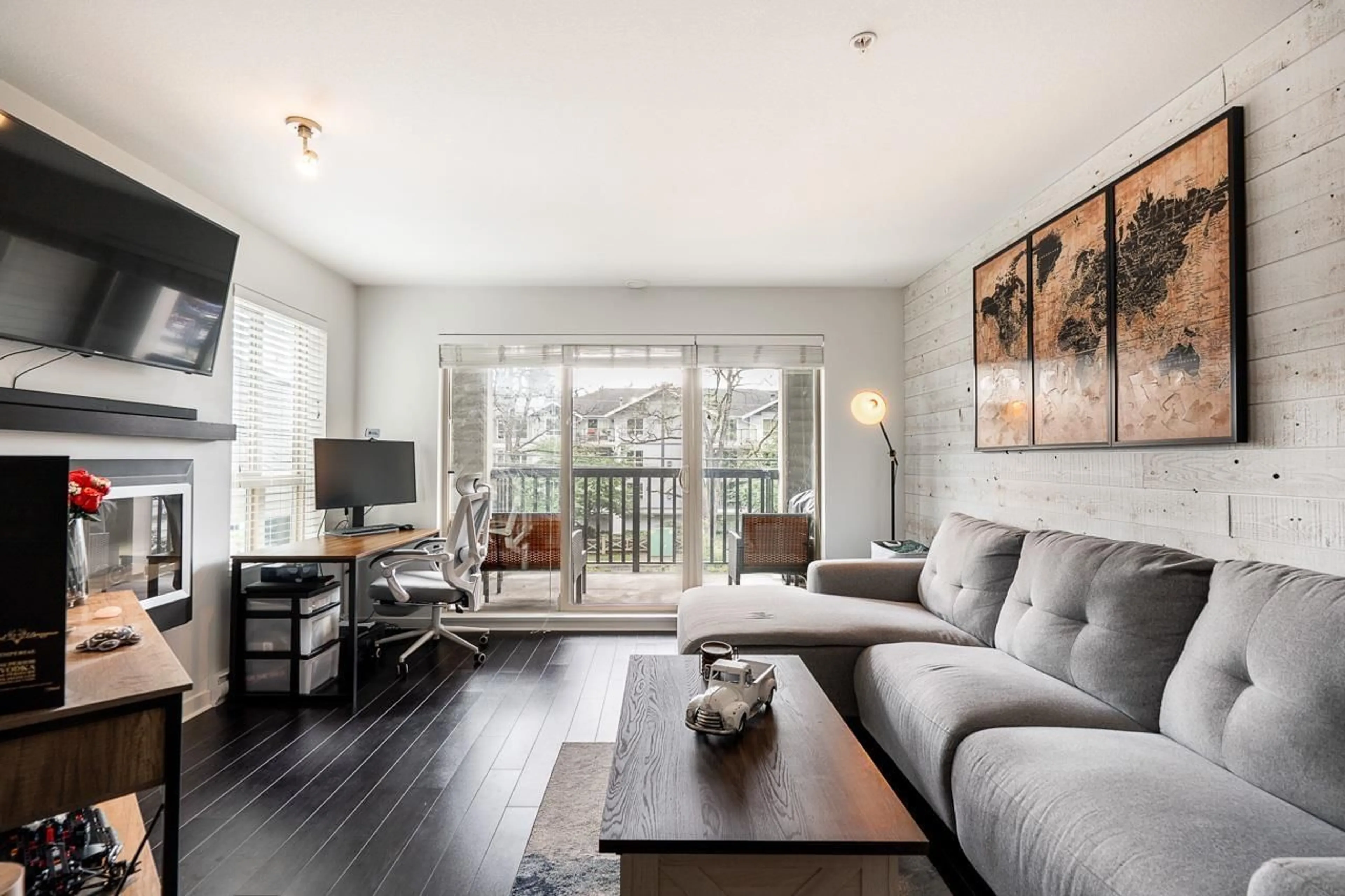 Living room with furniture, wood/laminate floor for 201 - 21009 56, Langley British Columbia V3A0C9