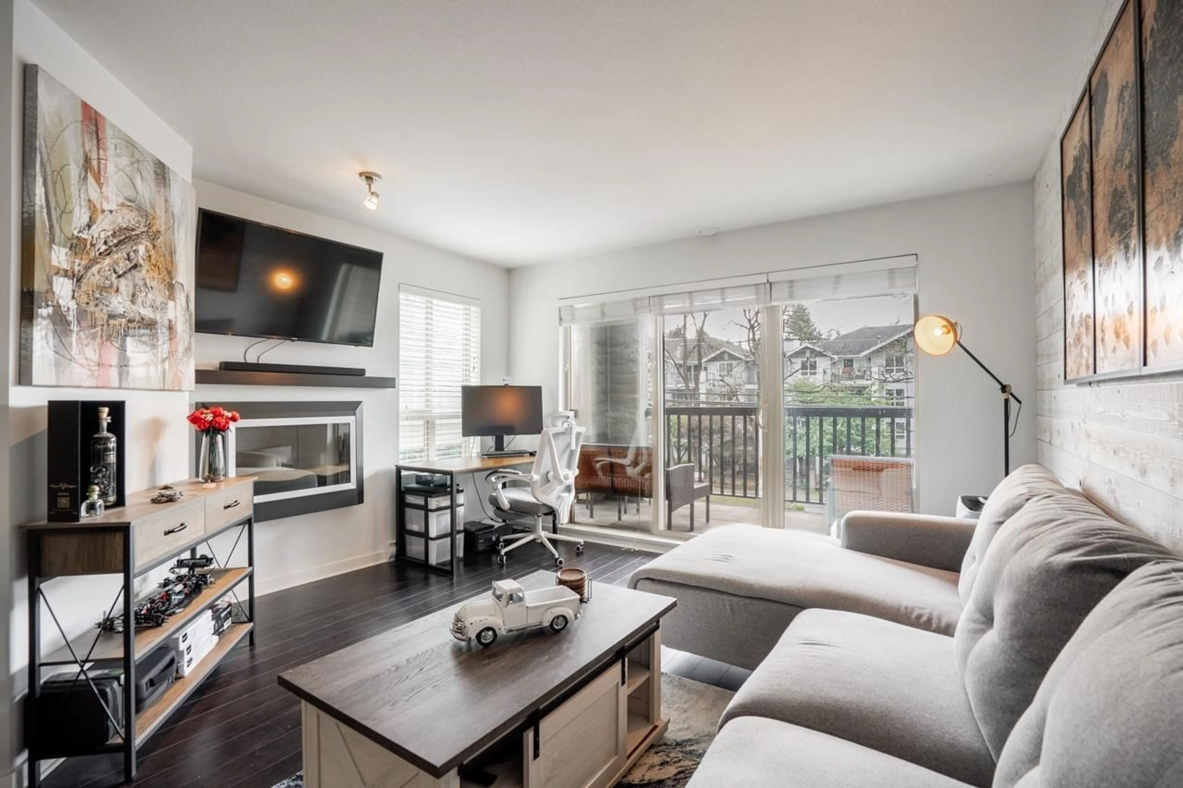 Living room with furniture, wood/laminate floor for 201 - 21009 56, Langley British Columbia V3A0C9