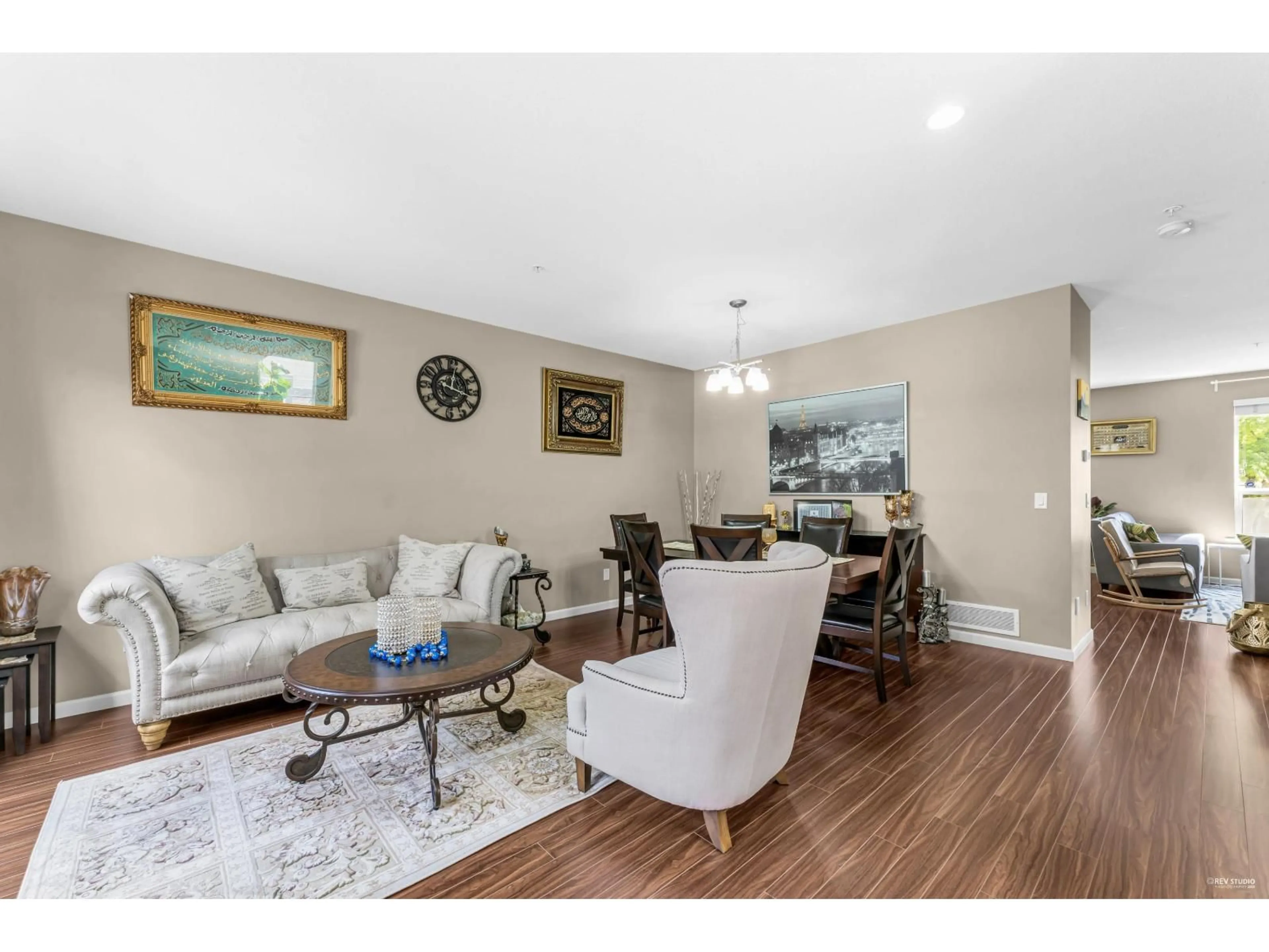 Living room with furniture, wood/laminate floor for 6940 208A, Langley British Columbia V2Y0G1