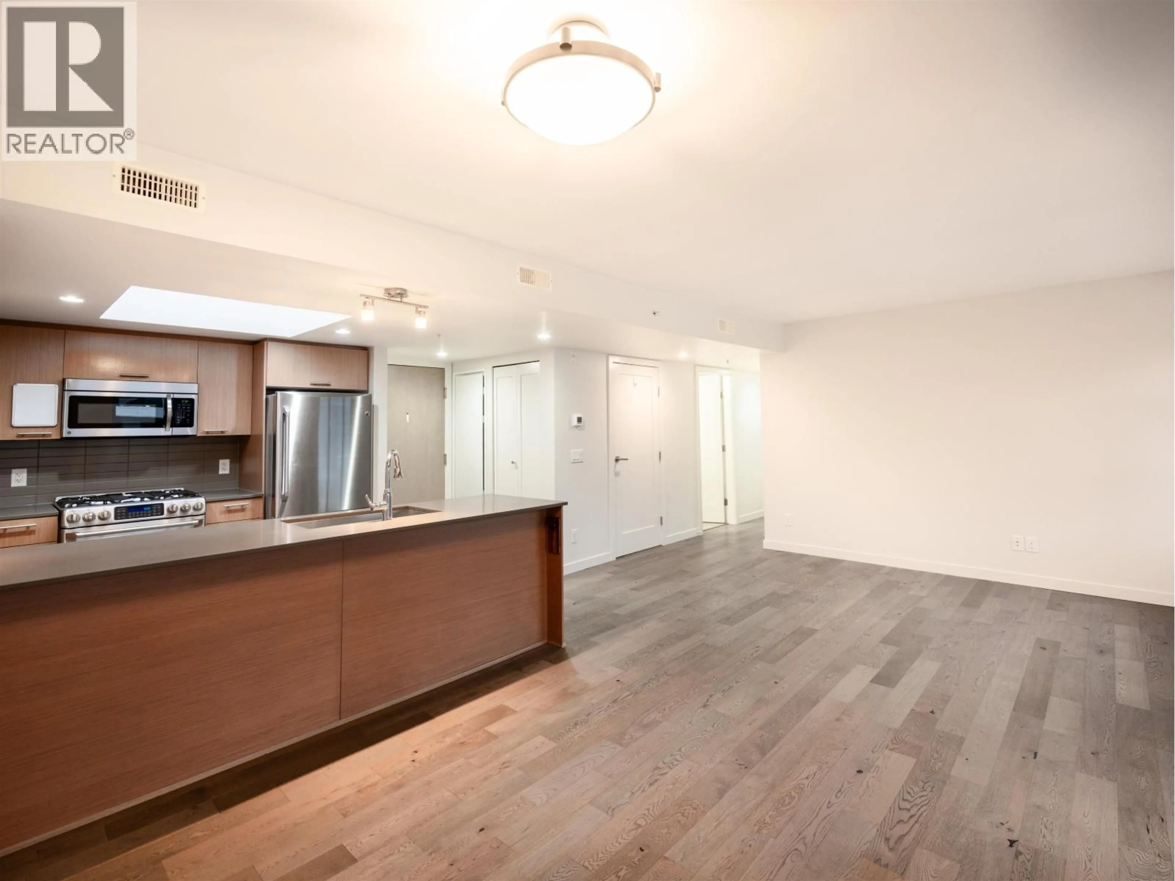Open concept kitchen, wood/laminate floor for 614 - 95 MOODY STREET, Port Moody British Columbia V3H0H2