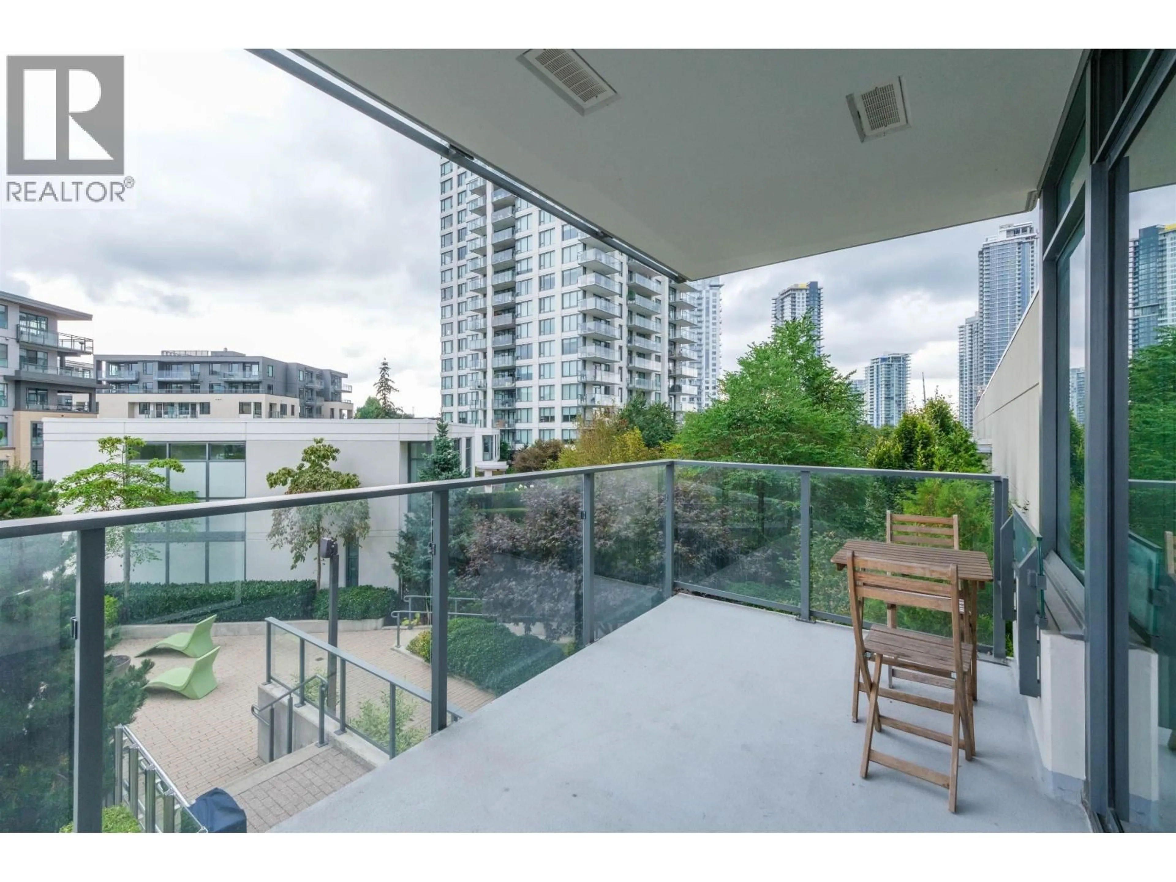 Patio, city buildings view from balcony for 306 - 602 COMO LAKE AVENUE, Coquitlam British Columbia V3J0G2