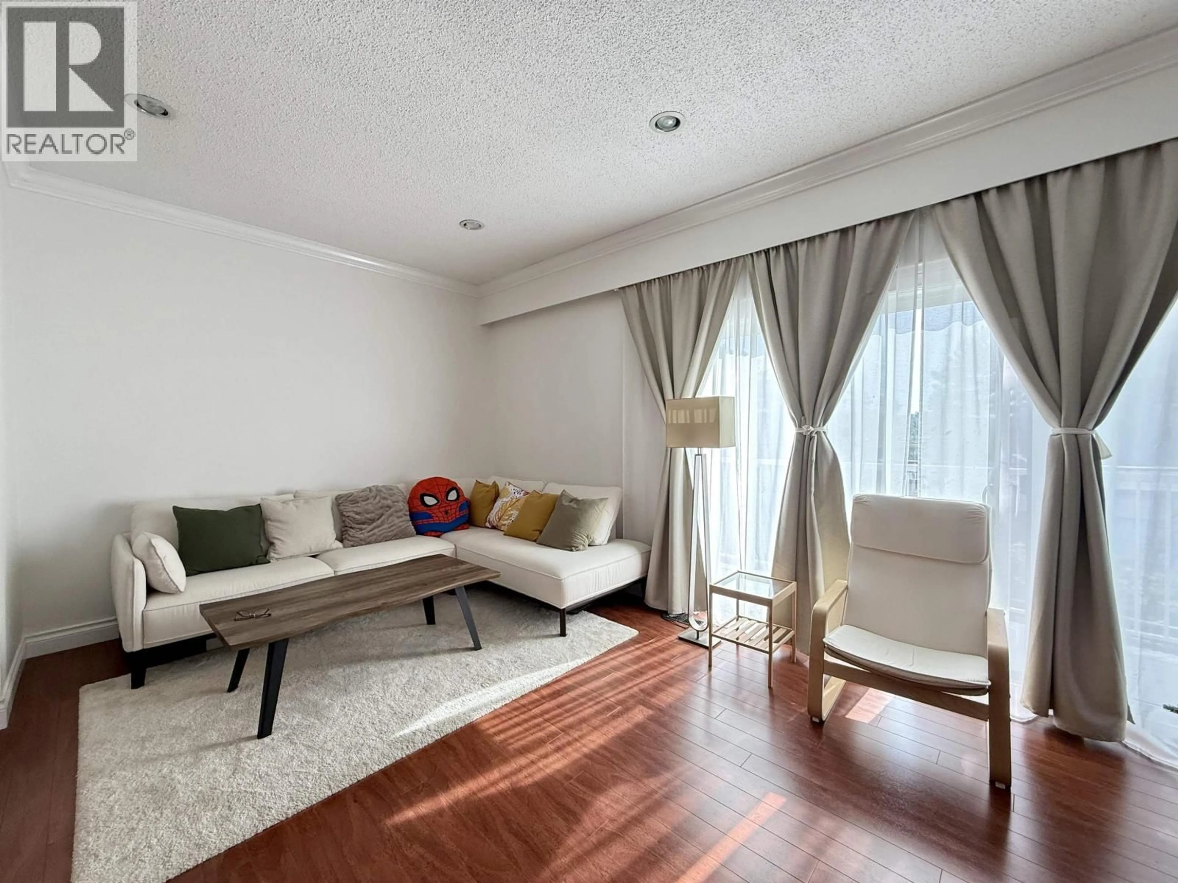 Living room with furniture, wood/laminate floor for 6722 KNEALE PLACE, Burnaby British Columbia V5B2Z2