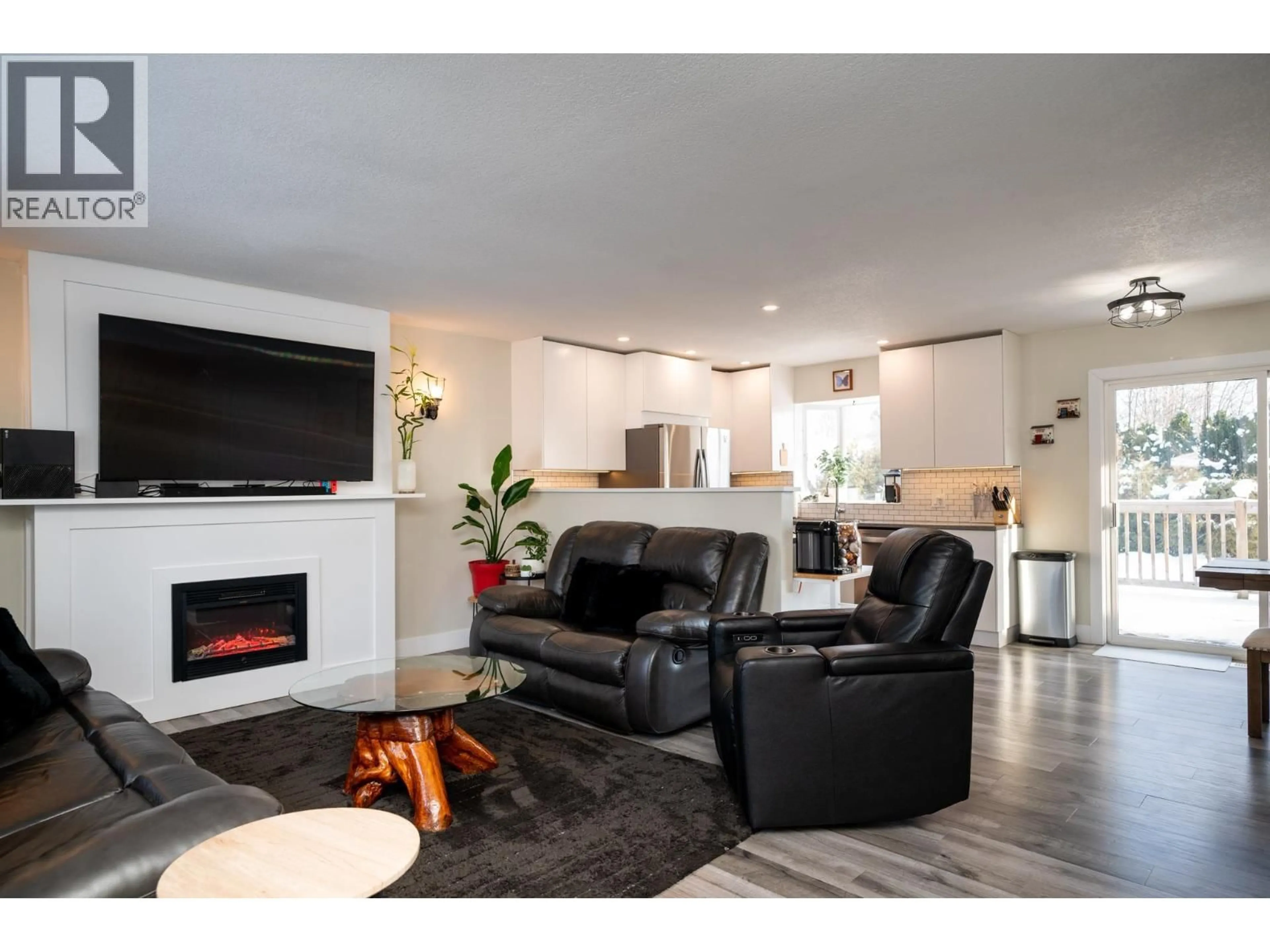 Living room with furniture, wood/laminate floor for 4150 BAKER ROAD, Prince George British Columbia V2N5K6