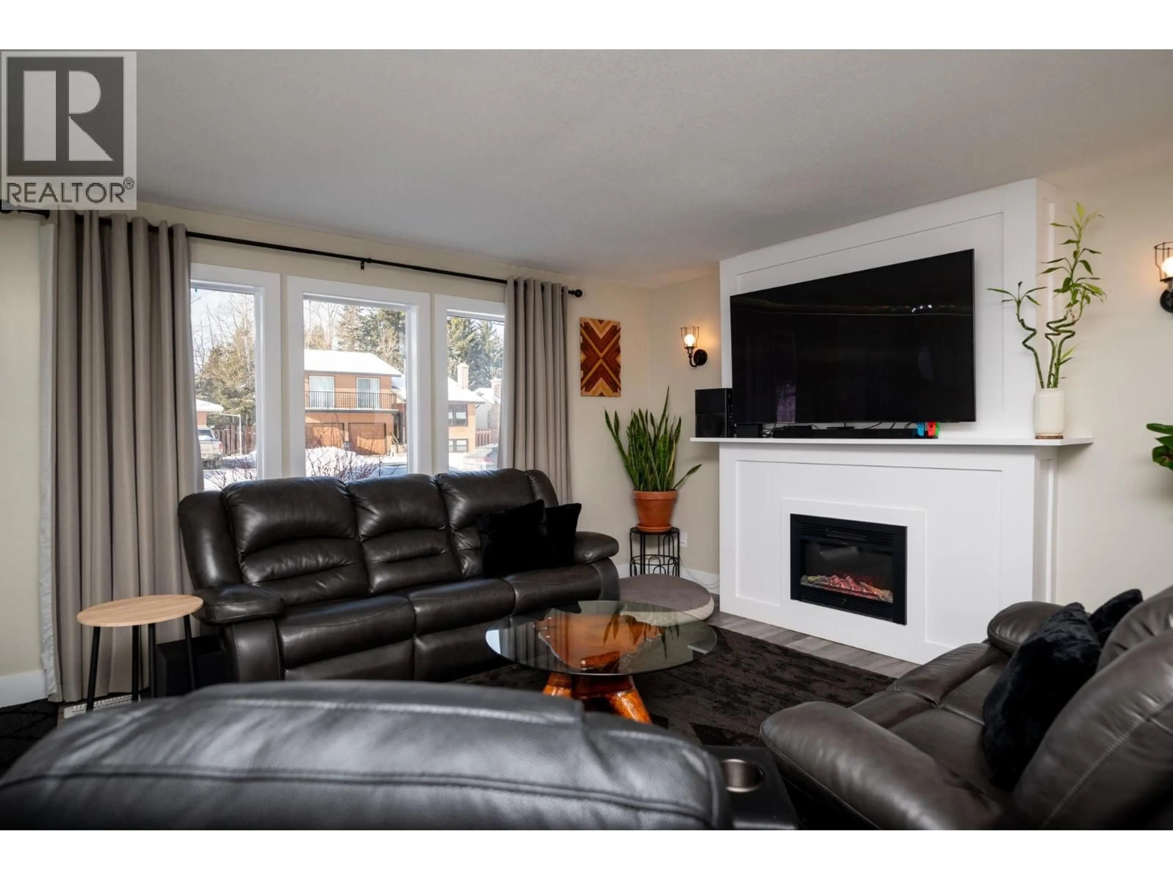 Living room with furniture, wood/laminate floor for 4150 BAKER ROAD, Prince George British Columbia V2N5K6