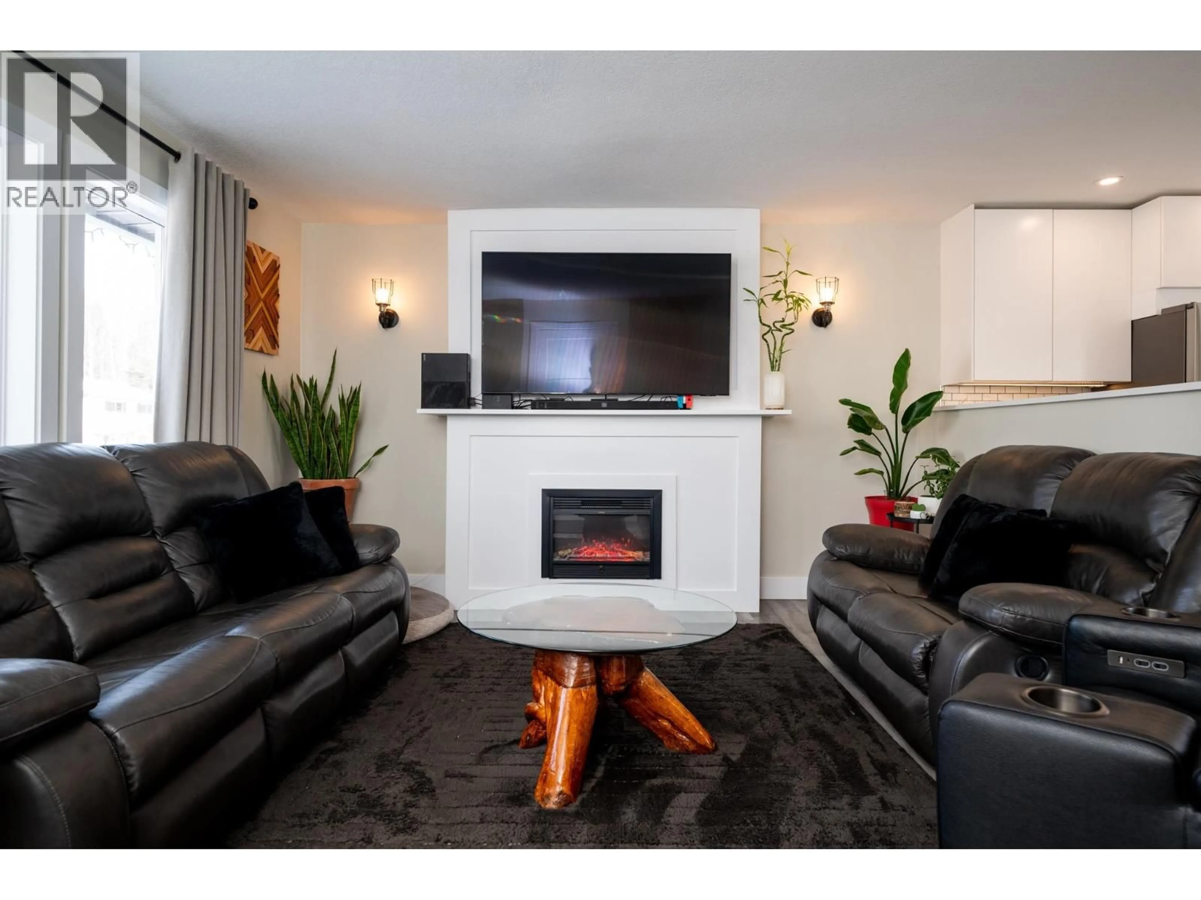 Living room with furniture, wood/laminate floor for 4150 BAKER ROAD, Prince George British Columbia V2N5K6