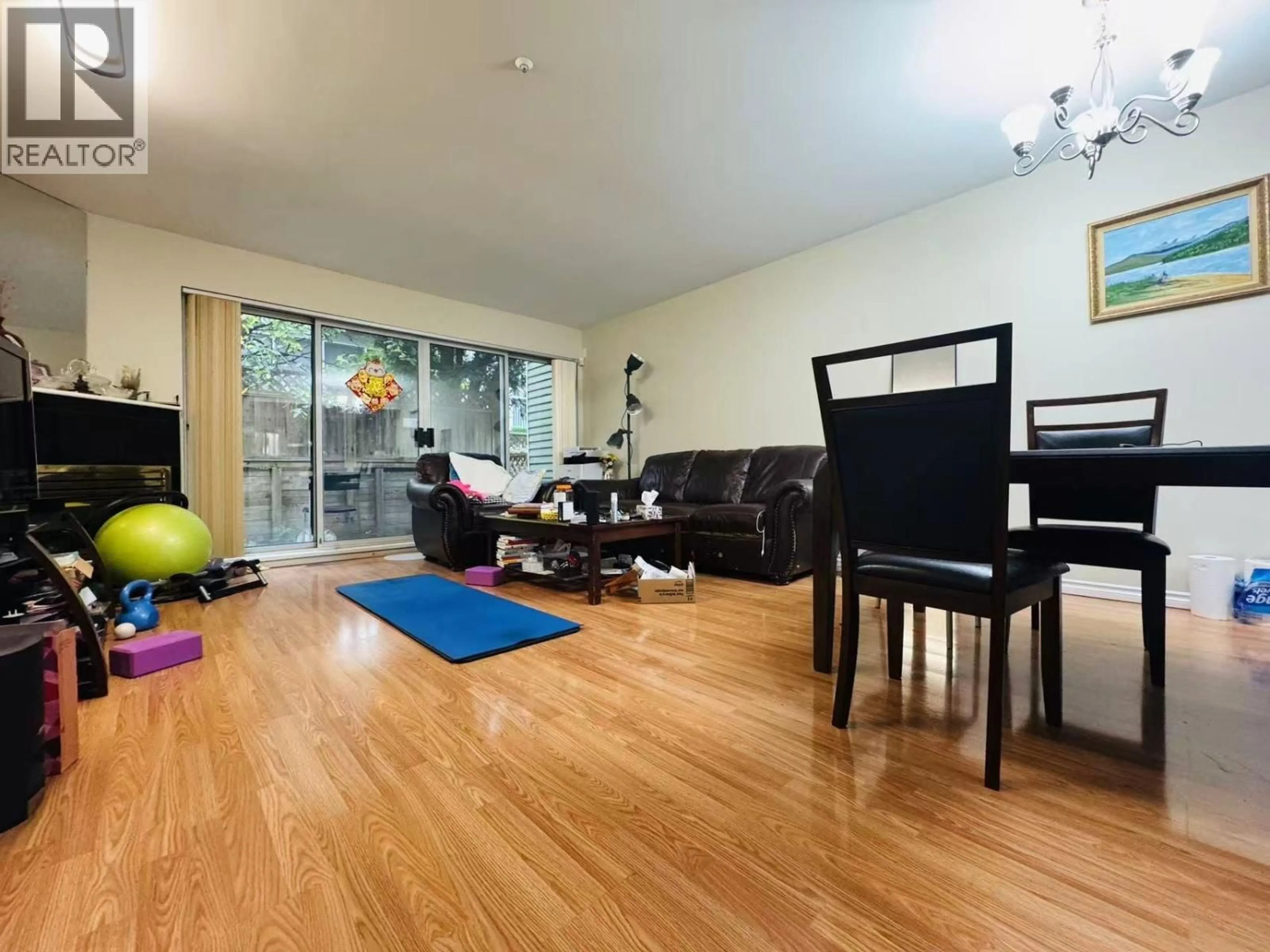 Living room with furniture, wood/laminate floor for 8410 KEYSTONE STREET, Vancouver British Columbia V5S4S2