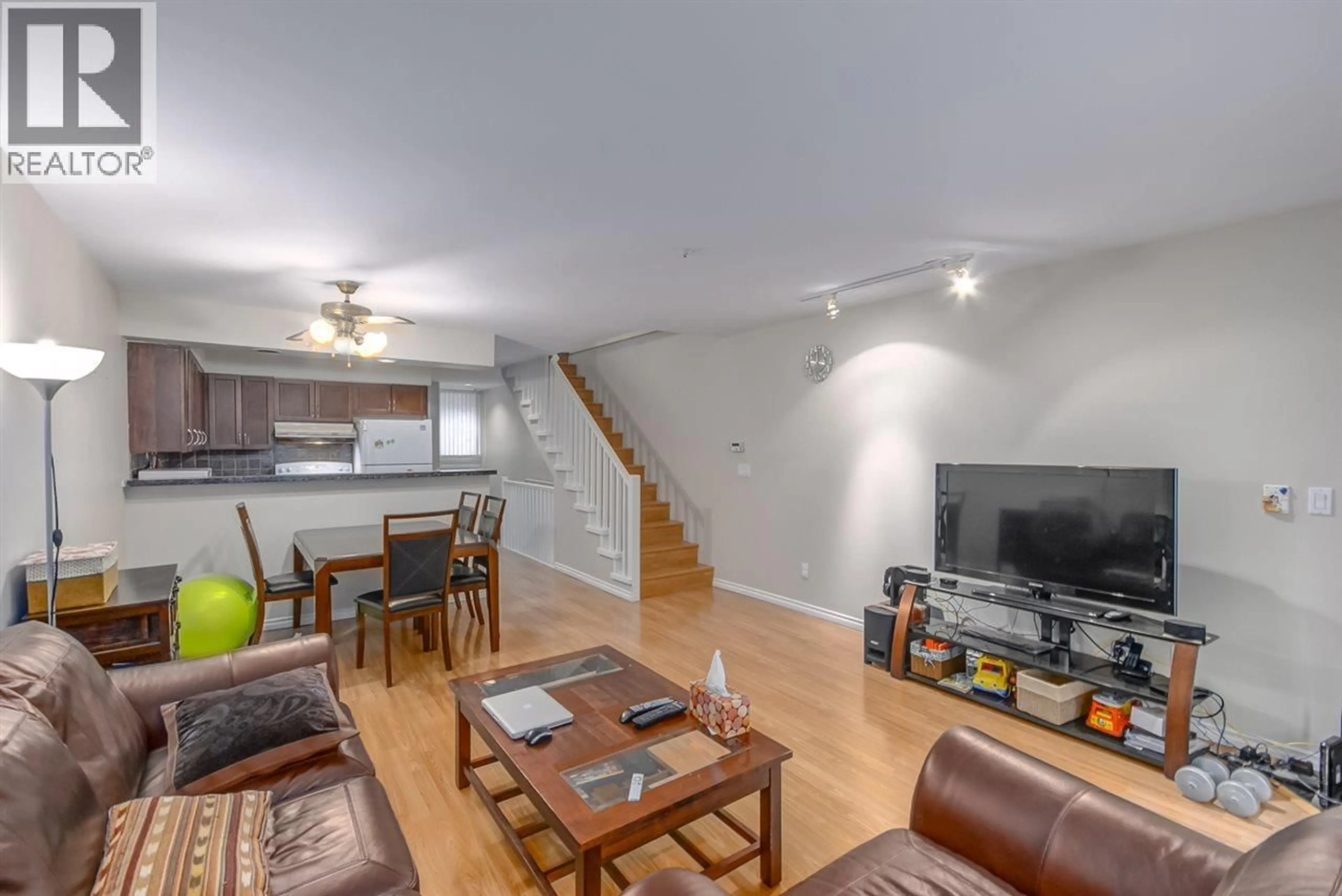 Living room with furniture, wood/laminate floor for 8410 KEYSTONE STREET, Vancouver British Columbia V5S4S2