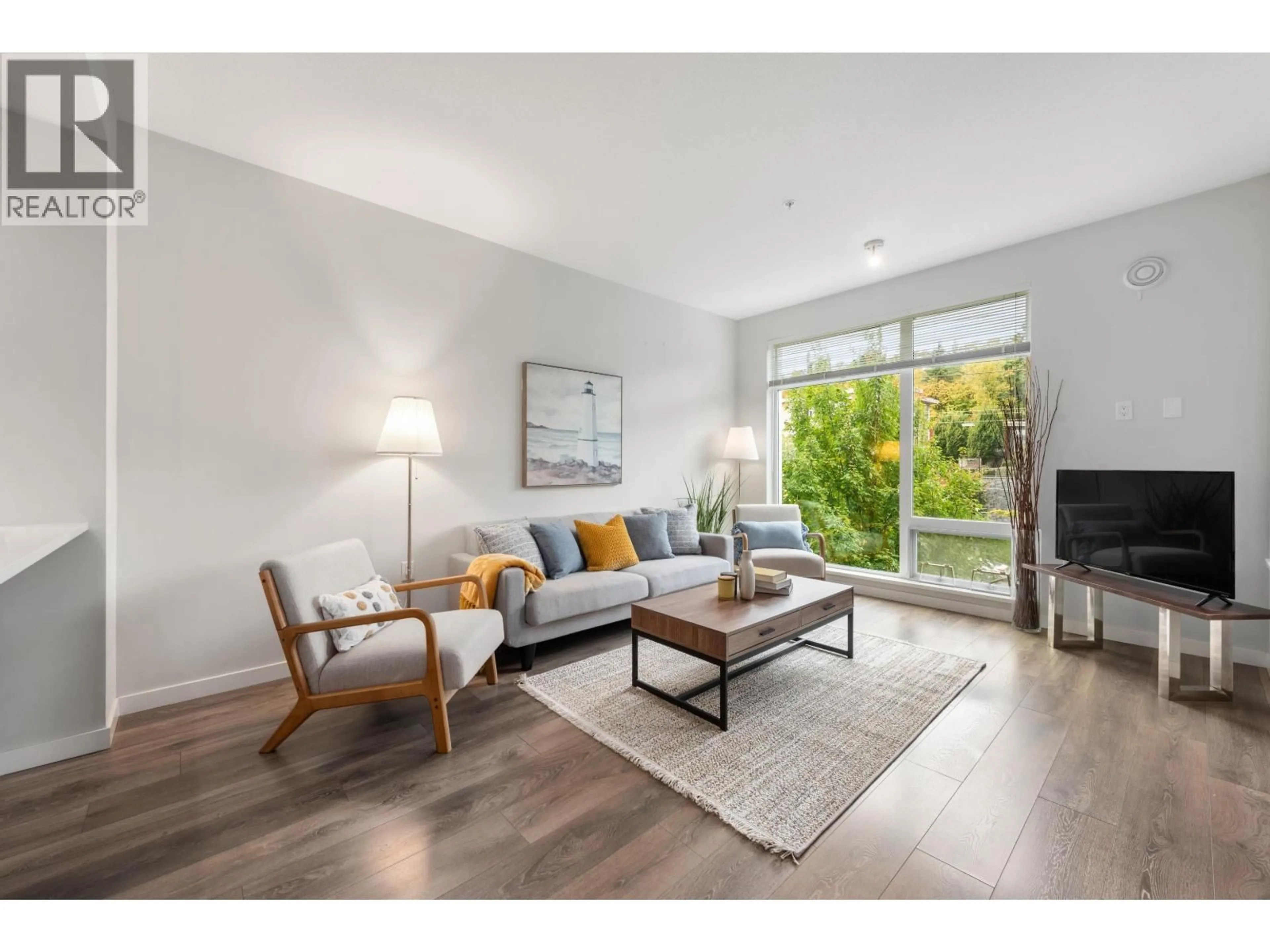 Living room with furniture, wood/laminate floor for 314 - 3289 RIVERWALK AVENUE, Vancouver British Columbia V5S0G2