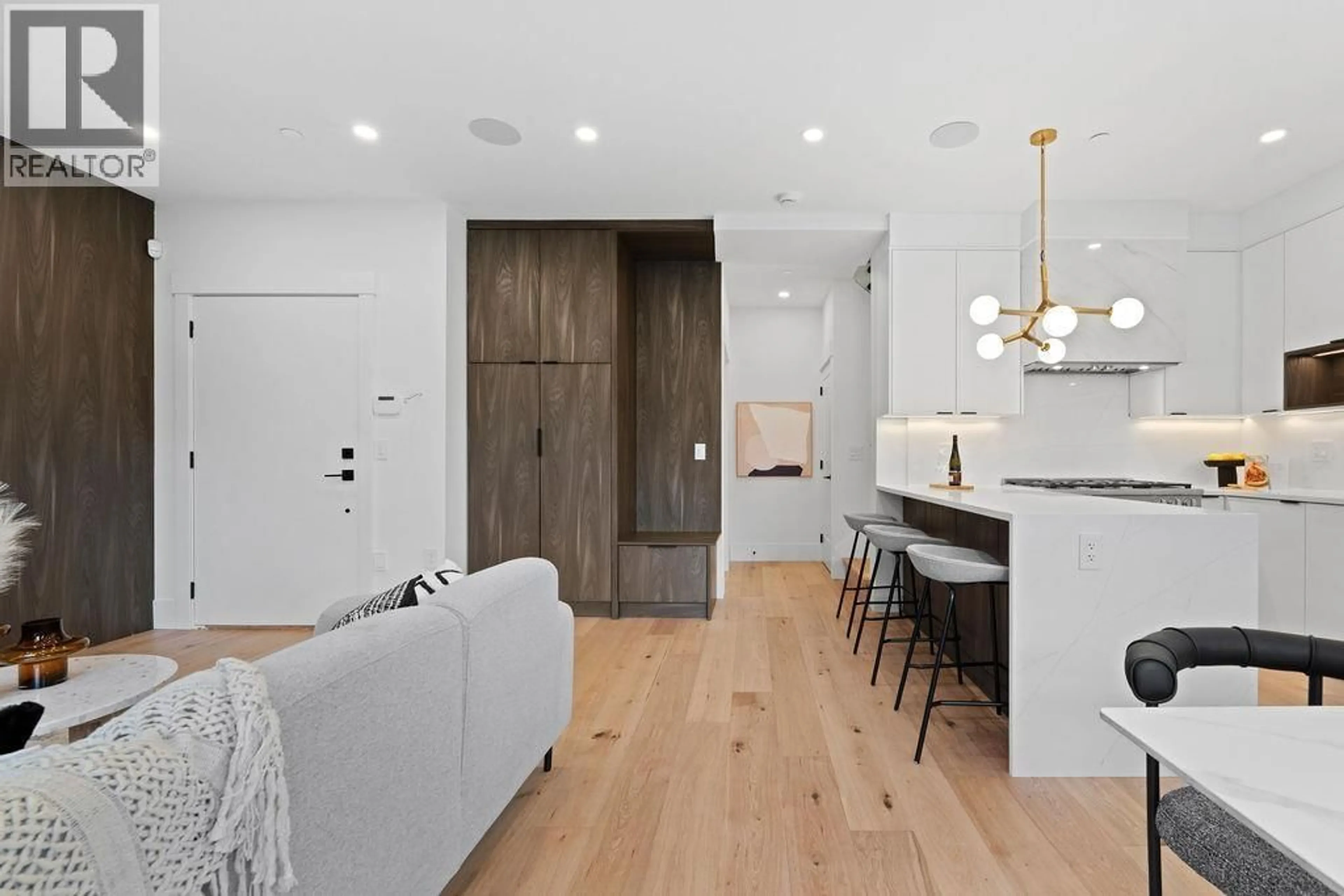 Open concept kitchen, wood/laminate floor for 2 - 4549 11TH AVENUE, Vancouver British Columbia V6R2M5
