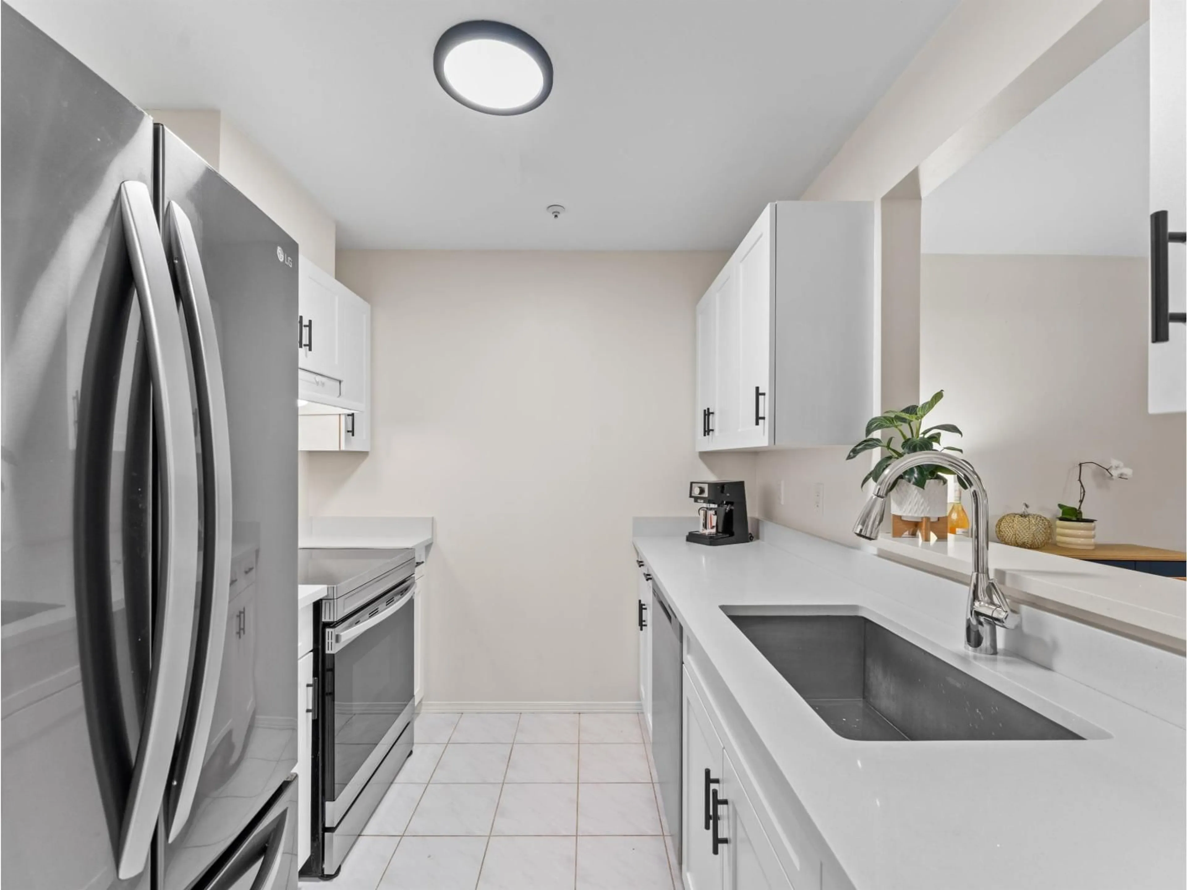 Standard kitchen, ceramic/tile floor for 110 - 14885 100, Surrey British Columbia V3R0W1