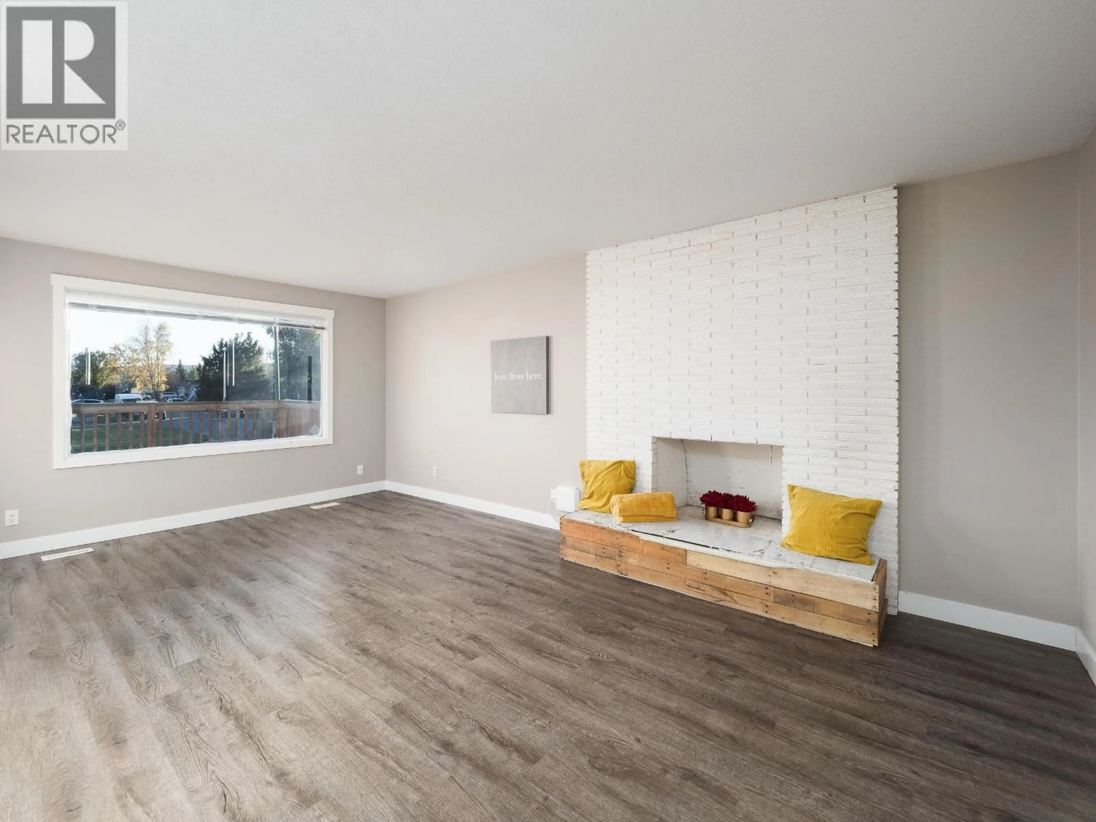 Living room with furniture, wood/laminate floor for 380 RILEY DRIVE, Prince George British Columbia V2M3P2