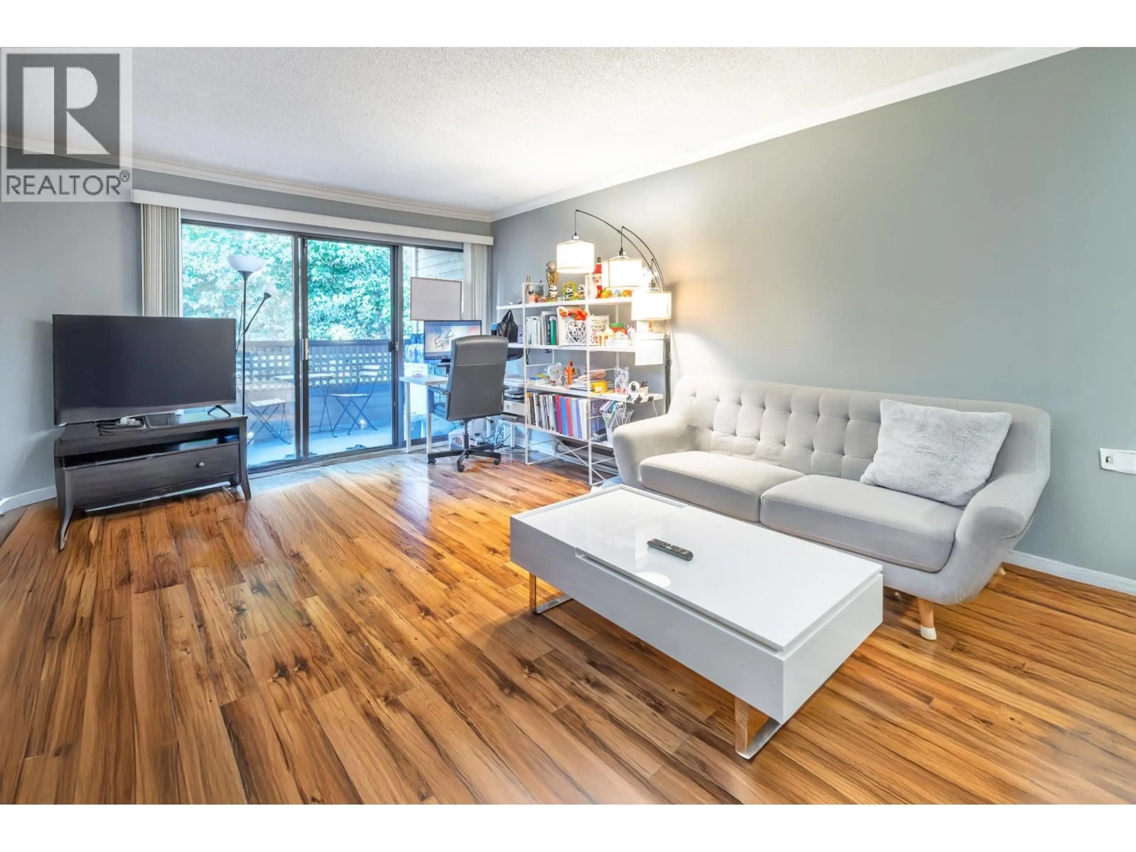 Living room with furniture, wood/laminate floor for 213 - 1195 PIPELINE ROAD, Coquitlam British Columbia V3B6J5