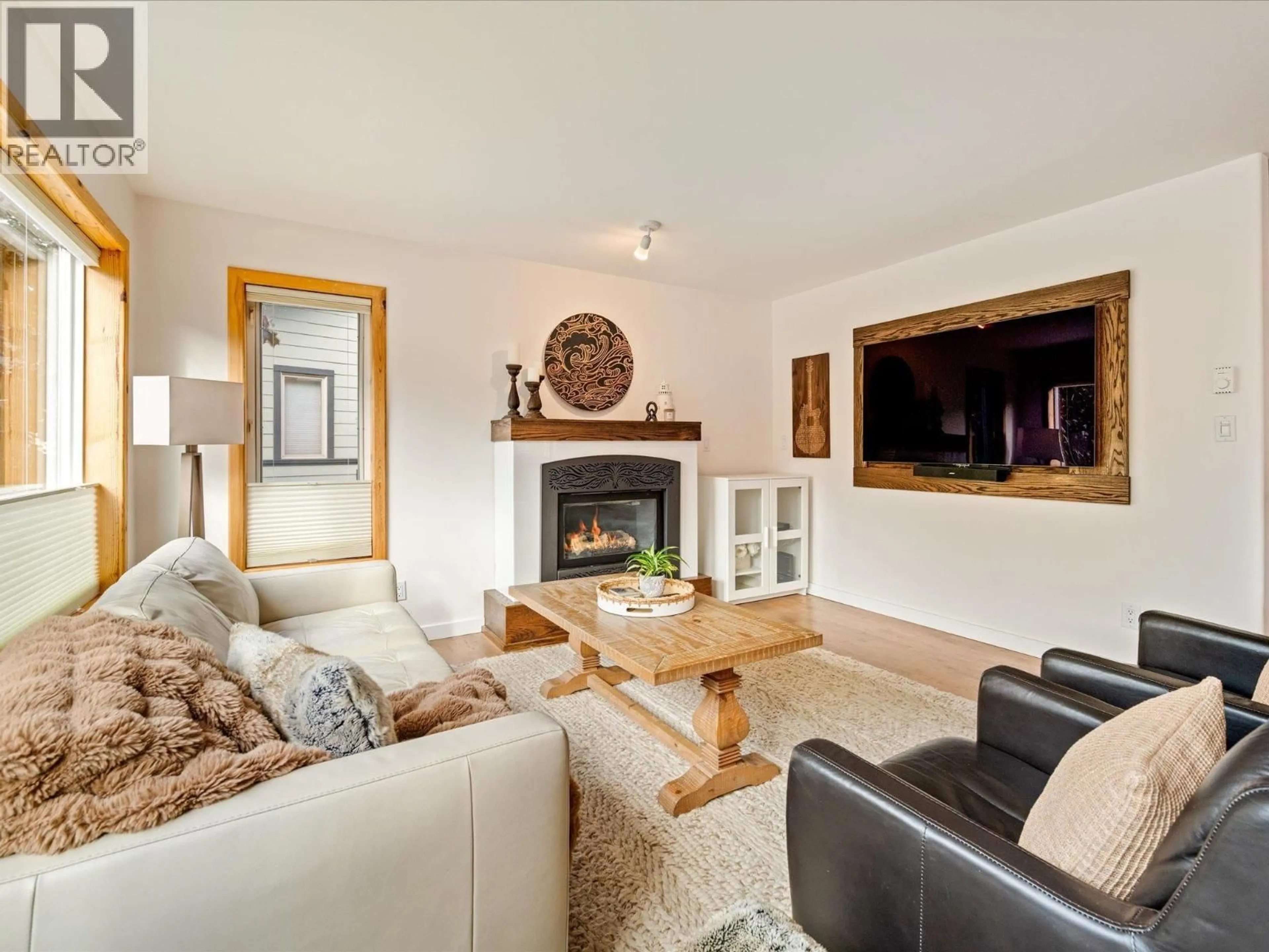 Living room with furniture, wood/laminate floor for 1425 WILLOW DRIVE, Pemberton British Columbia V0N2L0